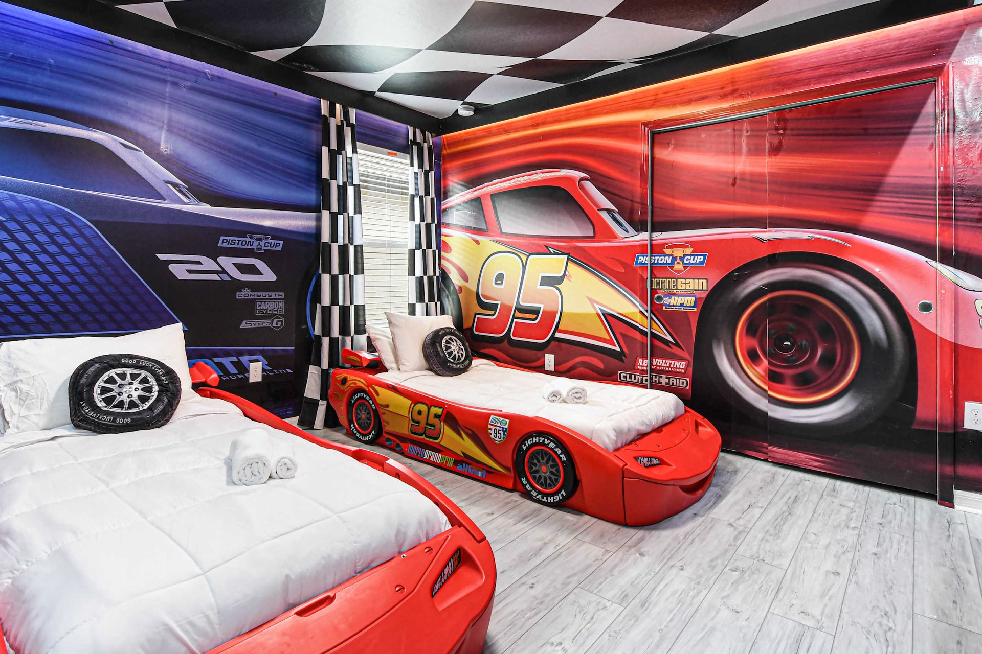 Rev up the fun in this Cars-themed room with race car beds!