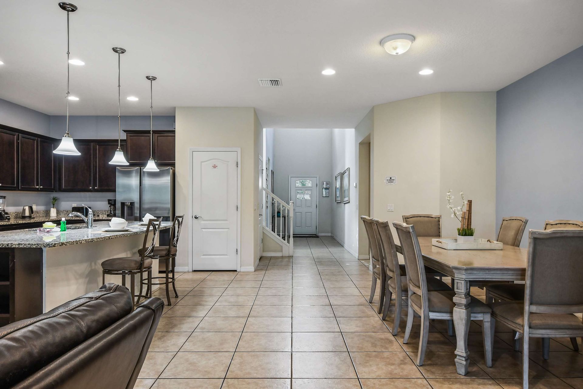 Spacious entryway leads to open kitchen and dining, perfect for group gatherings.