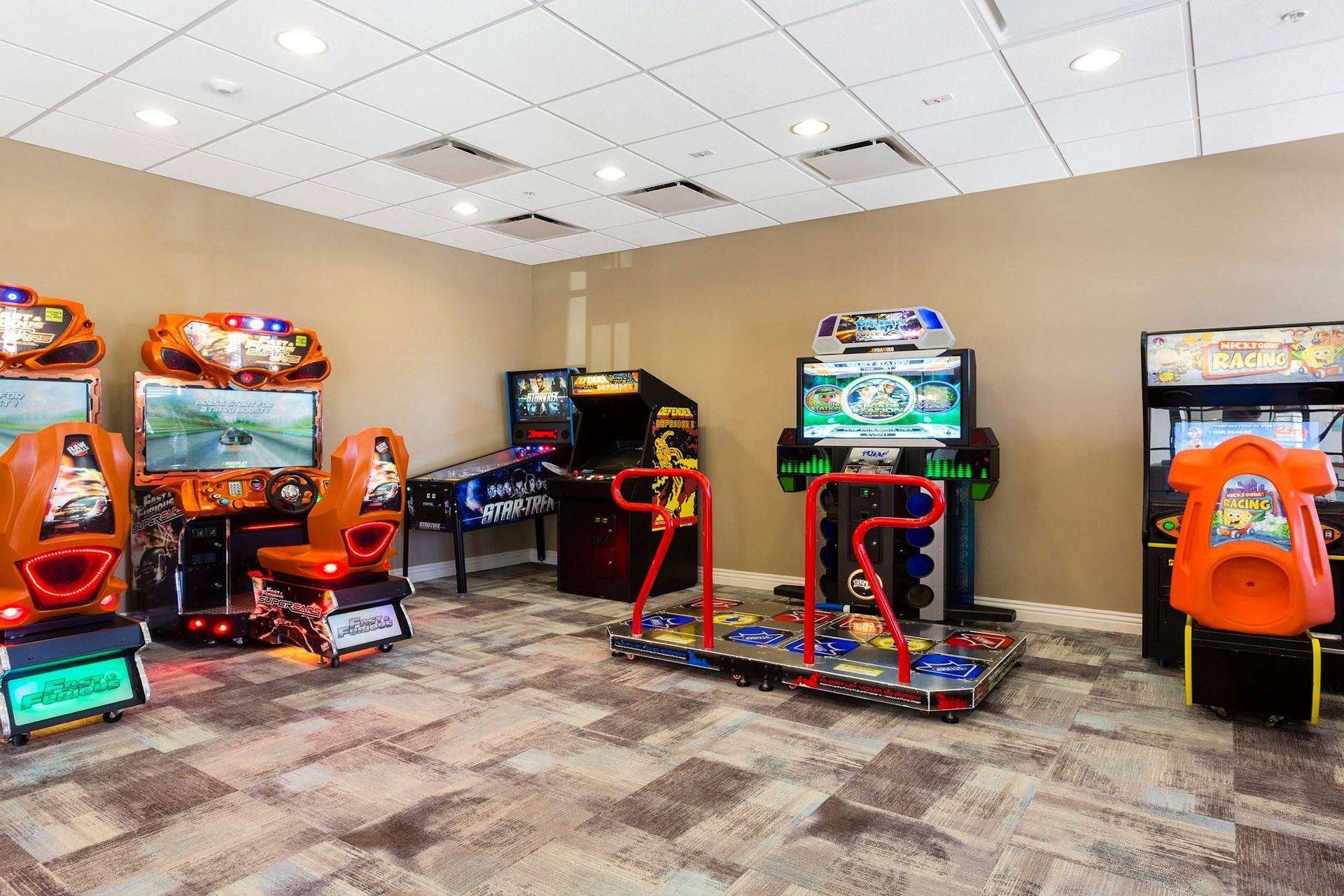 Enjoy thrilling games in the vibrant on-site arcade room