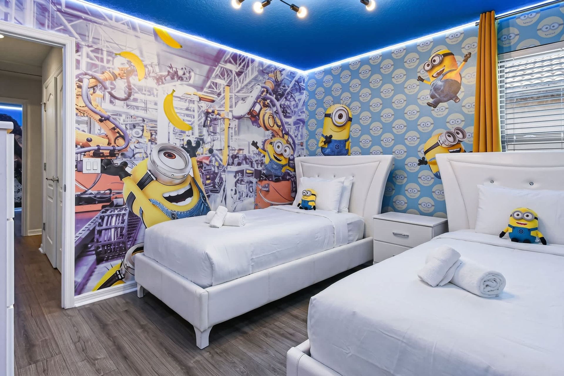 Fun-filled Minions-themed room with twin beds, bright decor, and playful vibes.