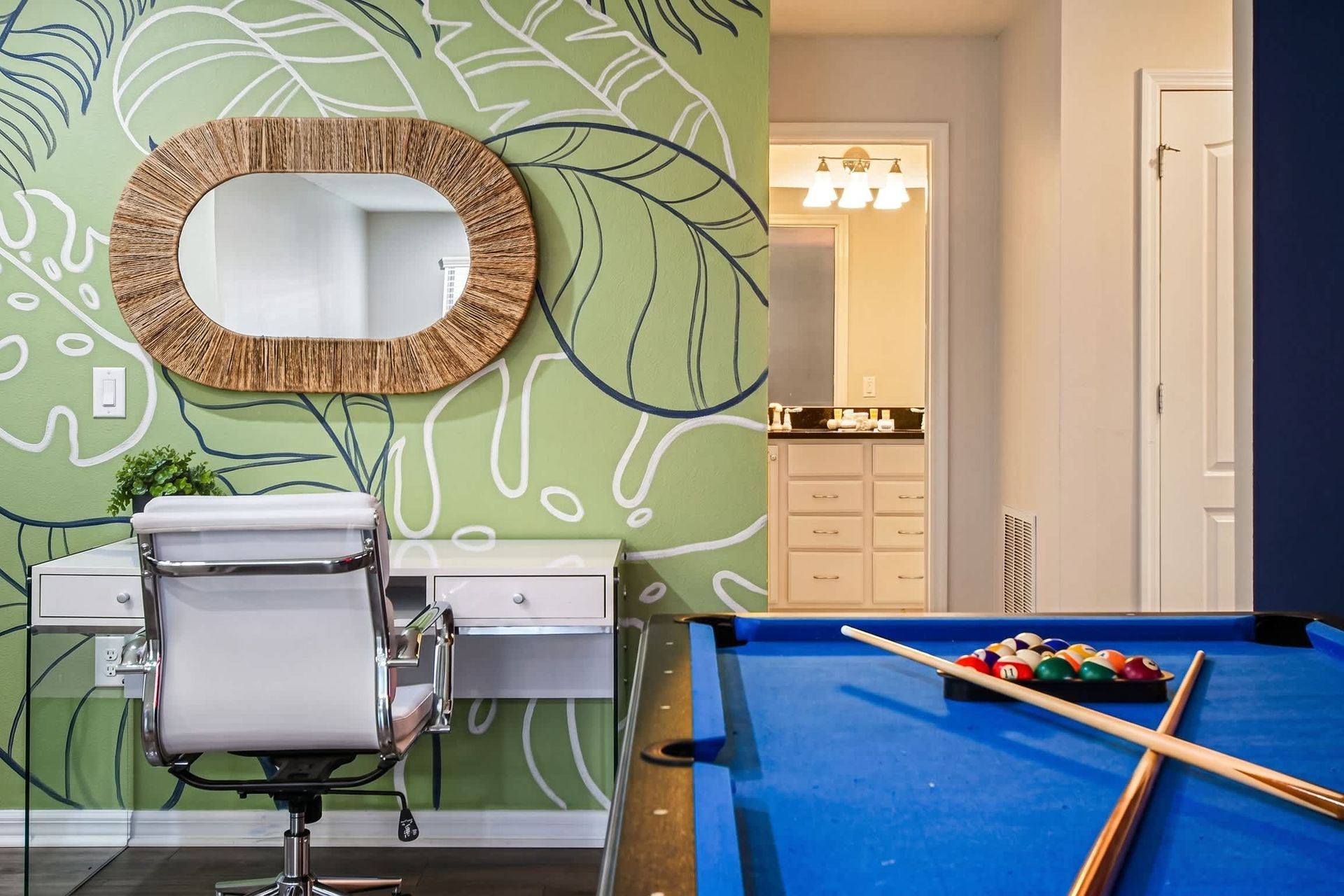 Tropical workspace and pool table in a vibrant, stylish and fun-filled loft area.