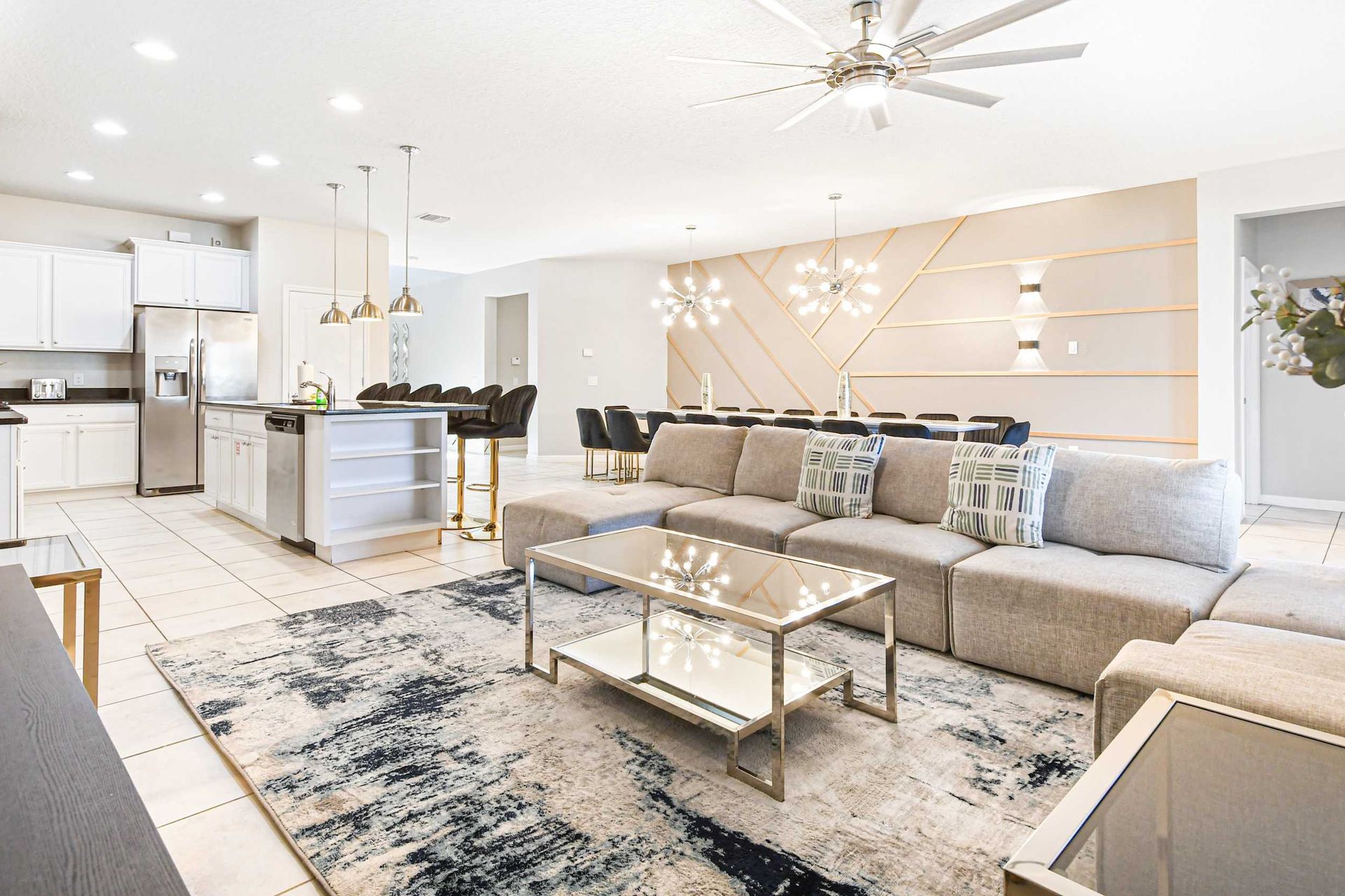 Stylish open living space with modern lighting and a spacious dining area.