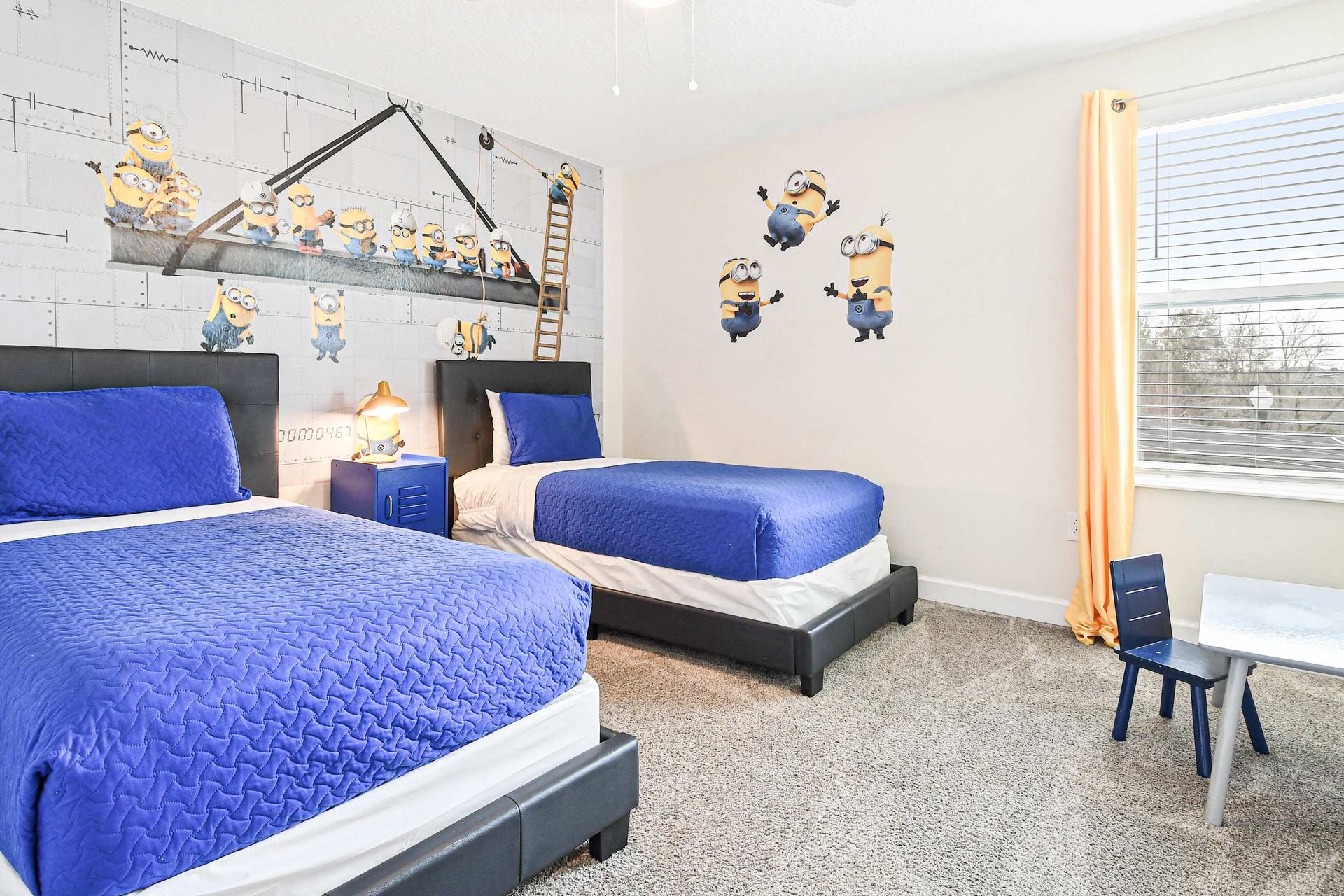 Minion madness! A playful, vibrant room for kids to enjoy with adorable Minion decor and cozy beds.