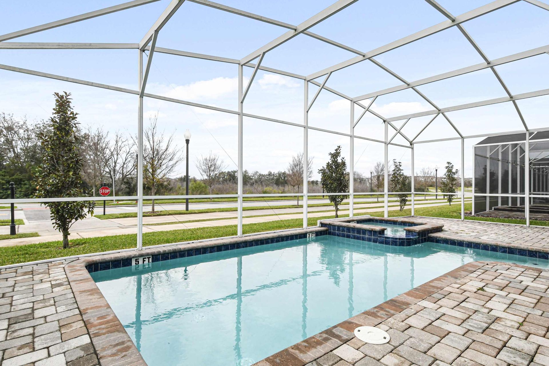 Dive into relaxation! Enjoy a refreshing swim in your private screened pool with a serene view.