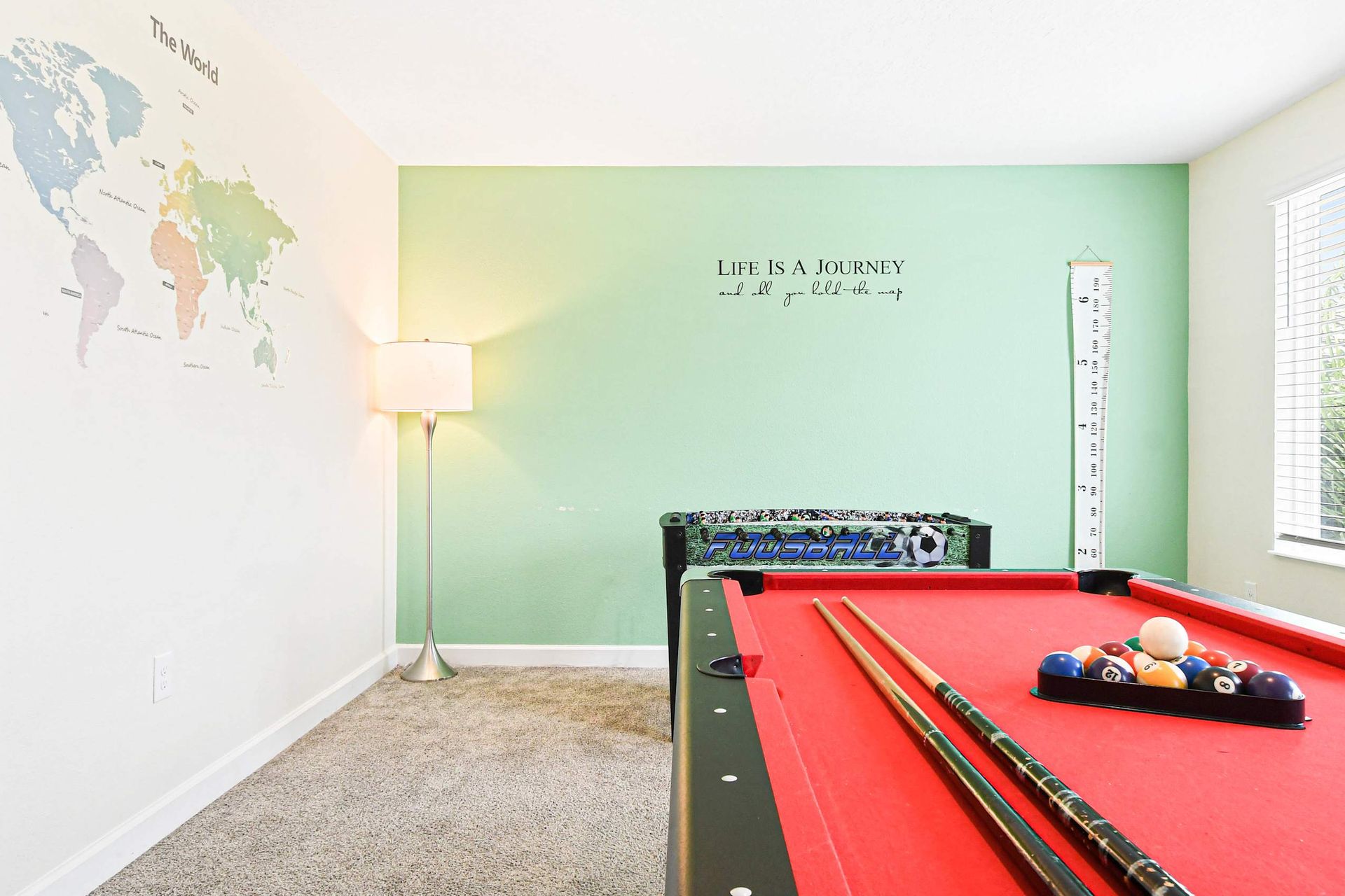 Game on! Enjoy endless fun in this vibrant rec room with pool, foosball, and a world of adventures!
