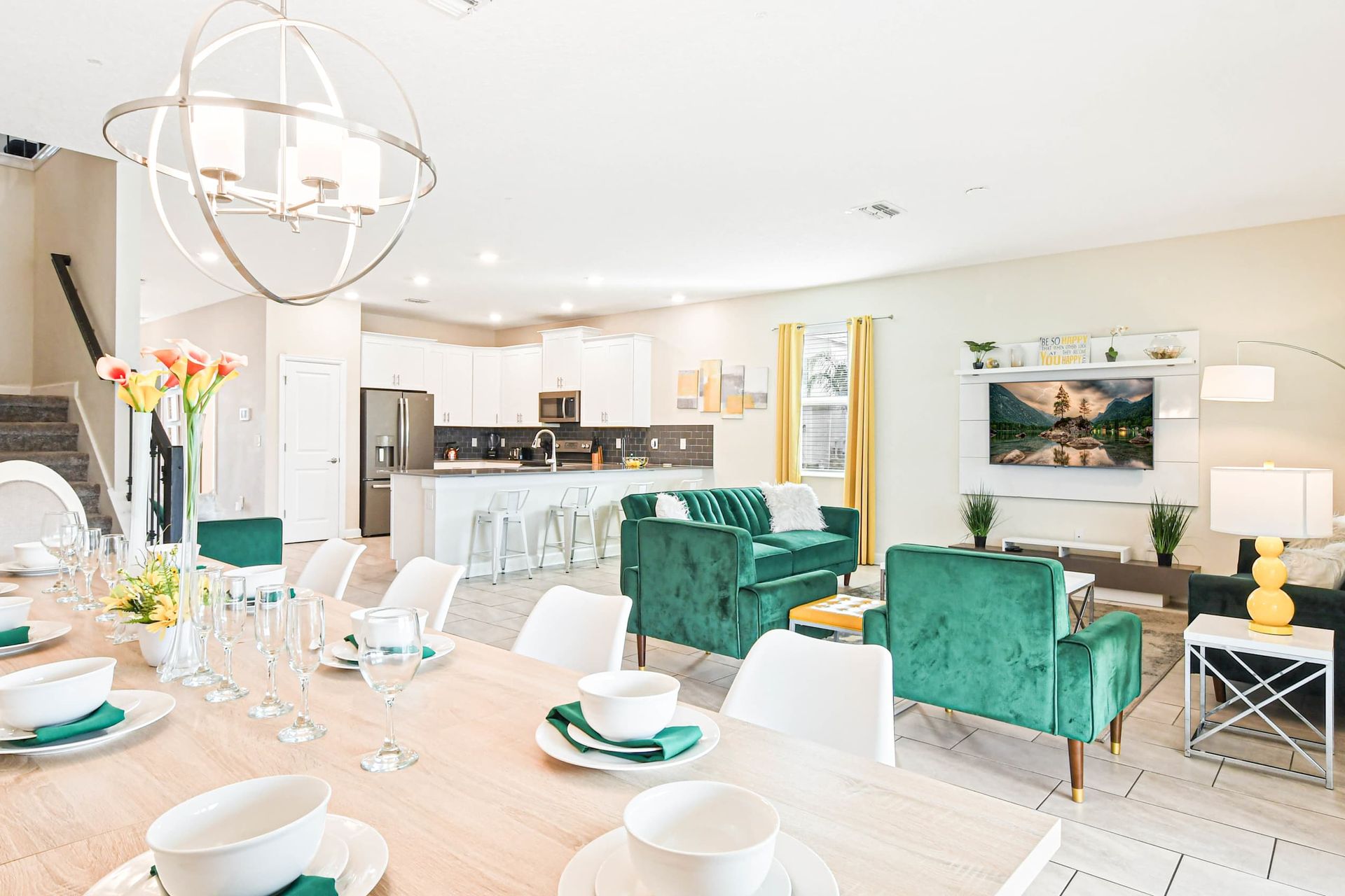 Stylish open-concept living and dining area with modern decor, vibrant seating, and a cozy atmosphere.