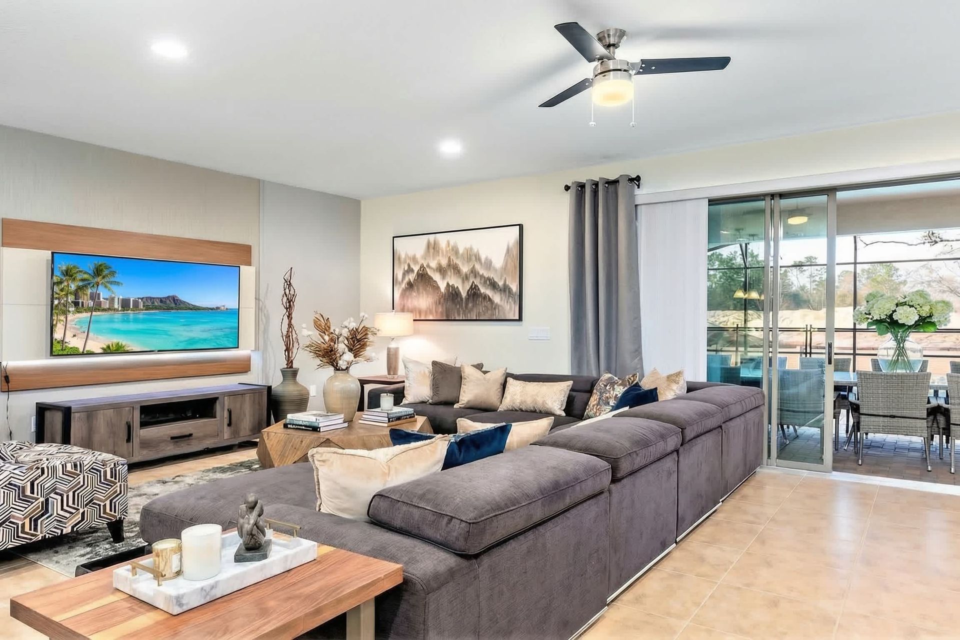 Stylish living area with sectional sofa, smart TV & patio access!