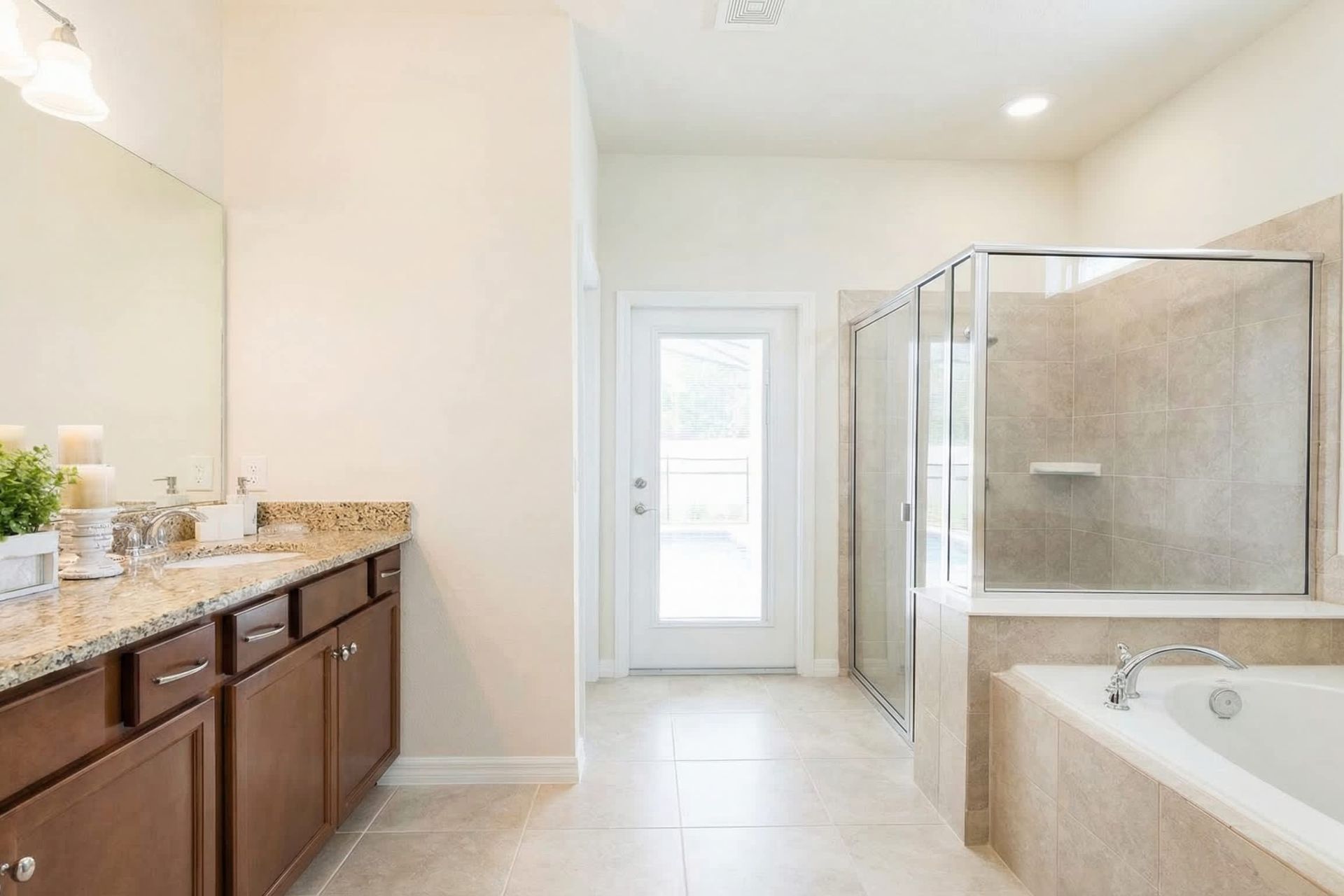 Spacious bathroom with dual sinks, walk-in shower, and soaking tub!