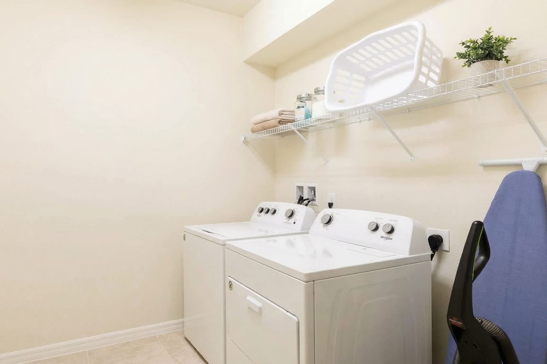Convenient laundry room with washer, dryer, and ample storage space!