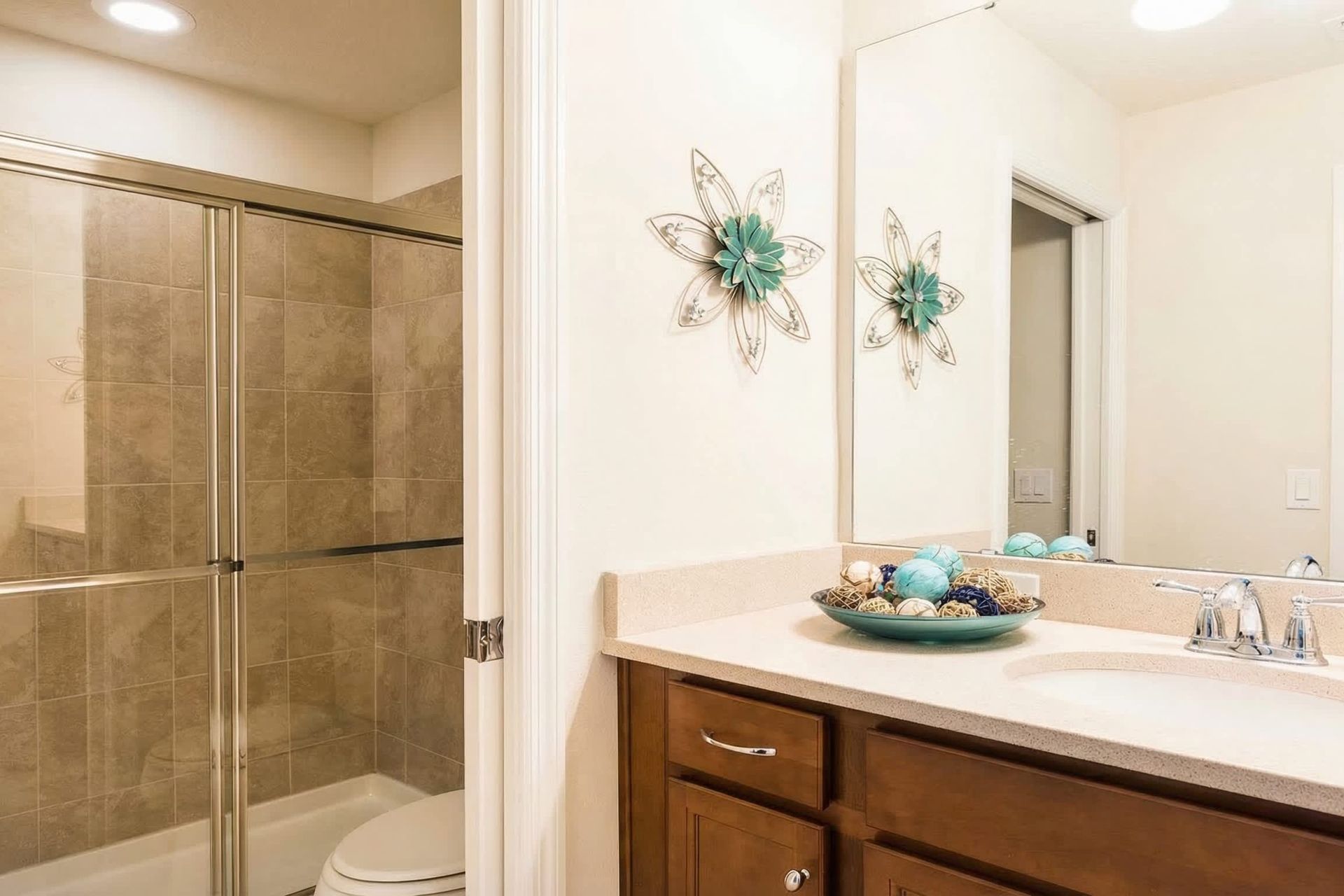 Cozy bathroom with walk-in shower, elegant decor, and warm tones!