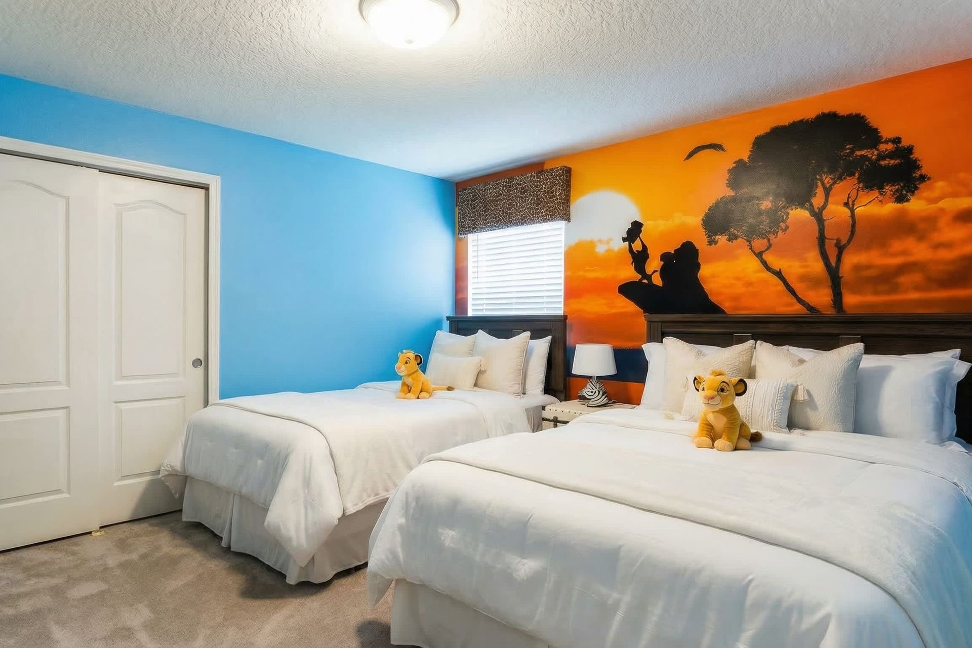 Safari-themed bedroom with vibrant decor and twin beds for kids!