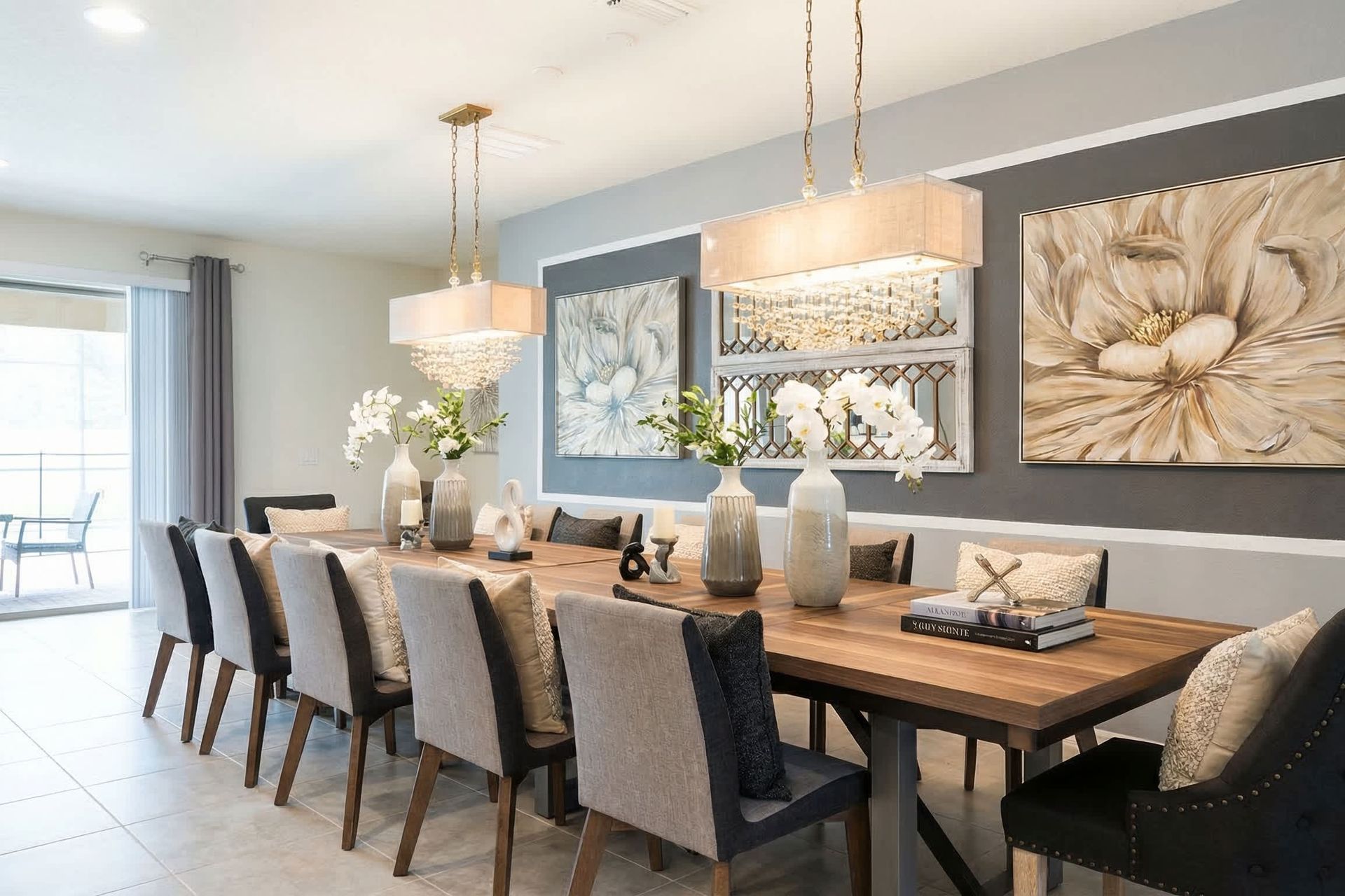 Stunning dining space with seating for 10, crystal chandeliers & floral art!