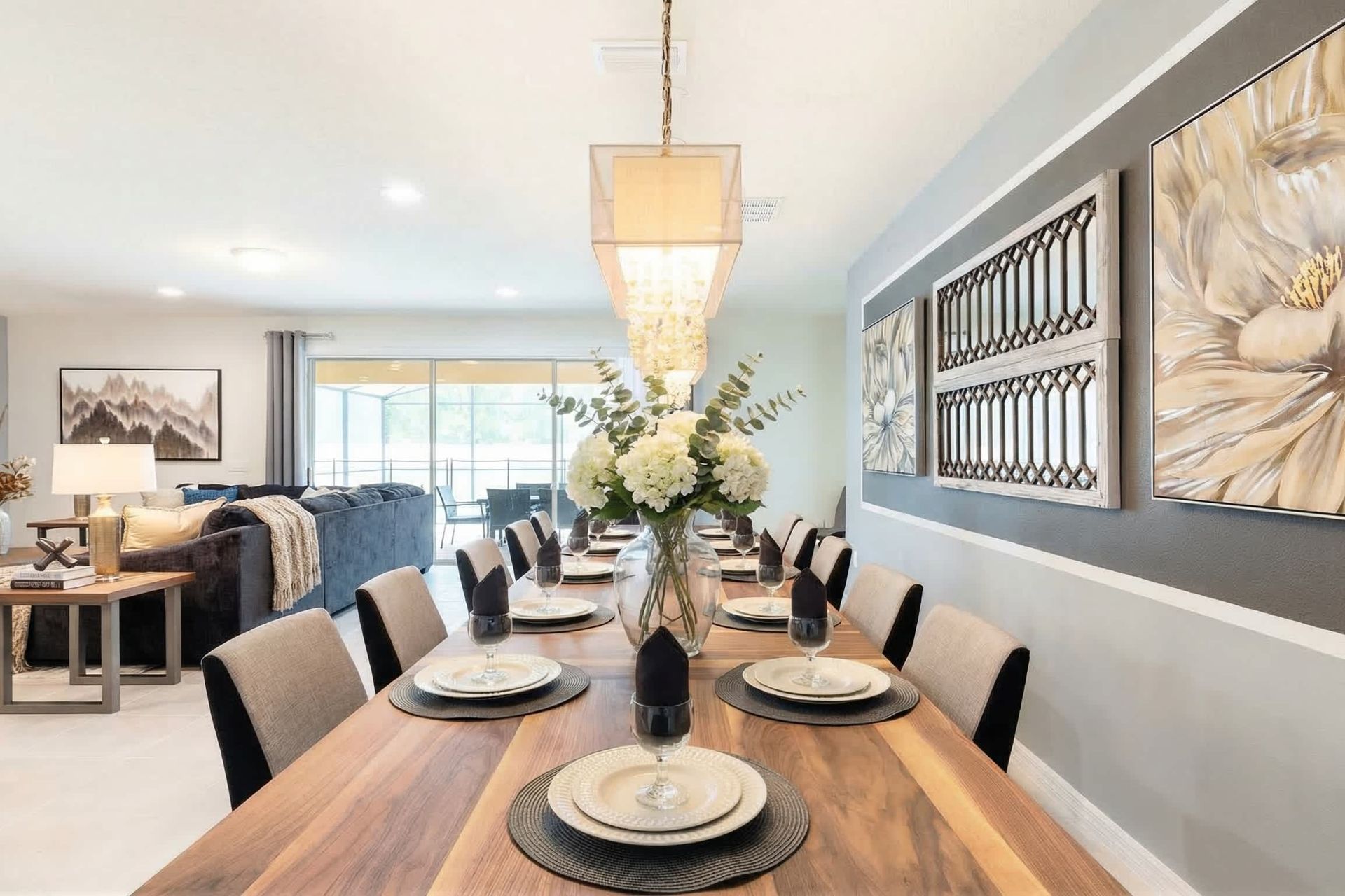 Elegant dining area with seating for 10, chic decor & warm lighting!