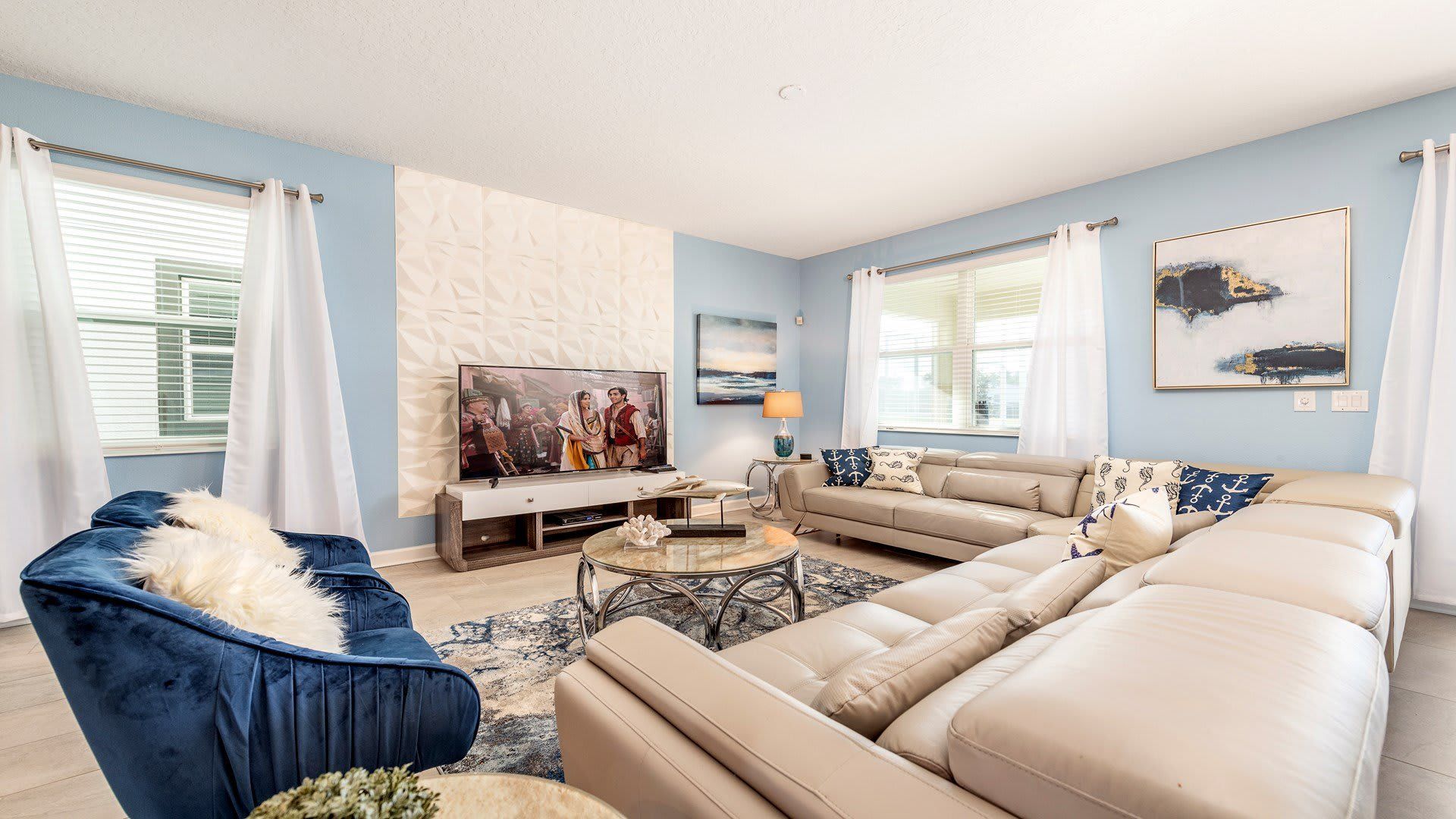 Stylish living room in pastels with elegant furnishings and a nautical theme.