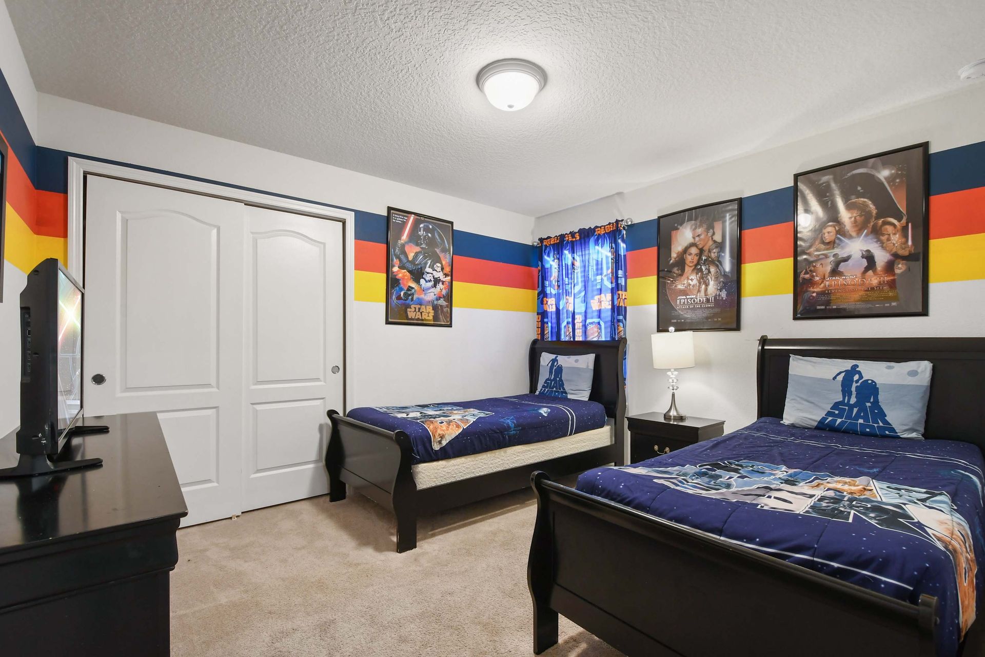 Fun and colorful twin bedroom perfect for kids and Star Wars fans of all ages.