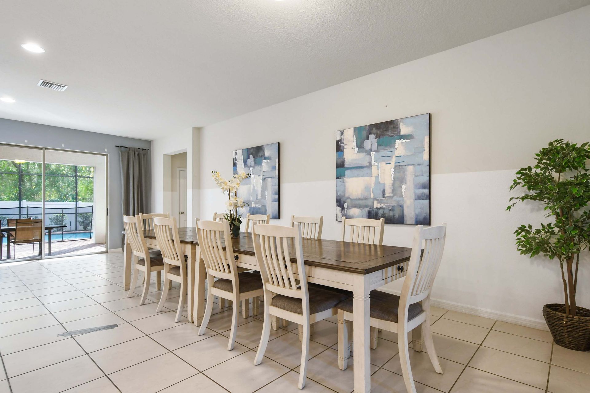 Spacious dining area with seating for ten, ideal for family meals and gatherings.