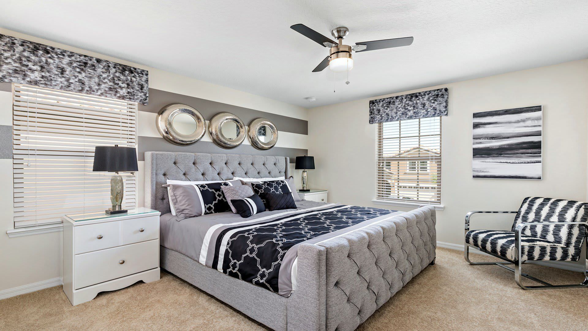 Sophisticated black and white king sized bed bedroom.