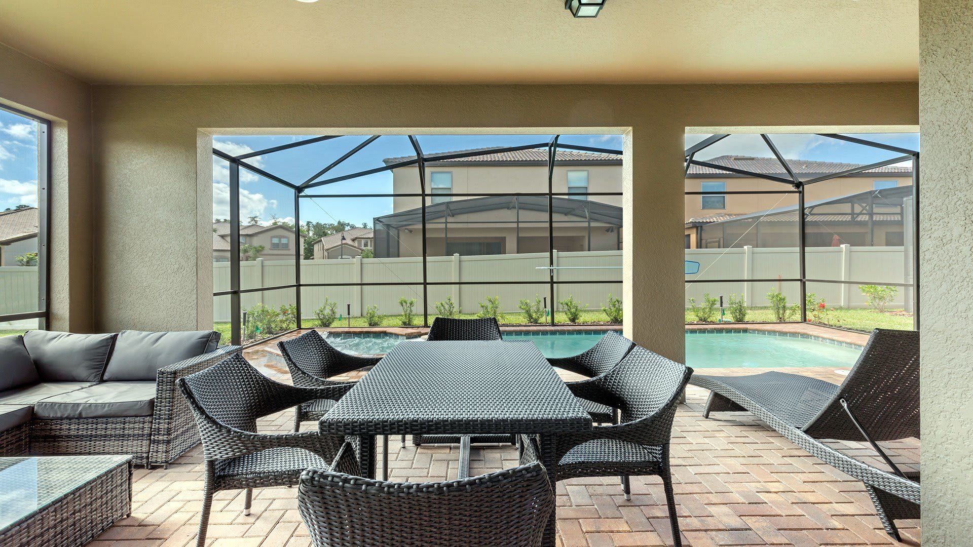 A stylish outdoor seating area beside the pool