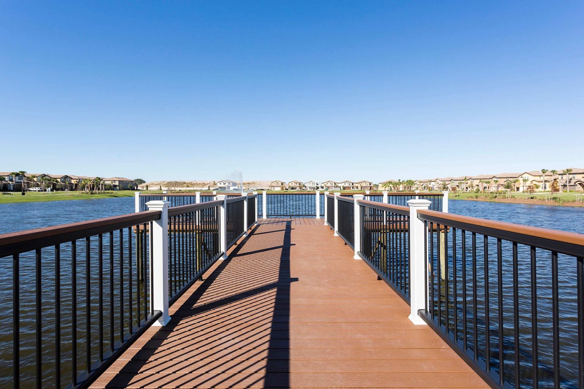 Scenic lakefront dock with picturesque water and community views
