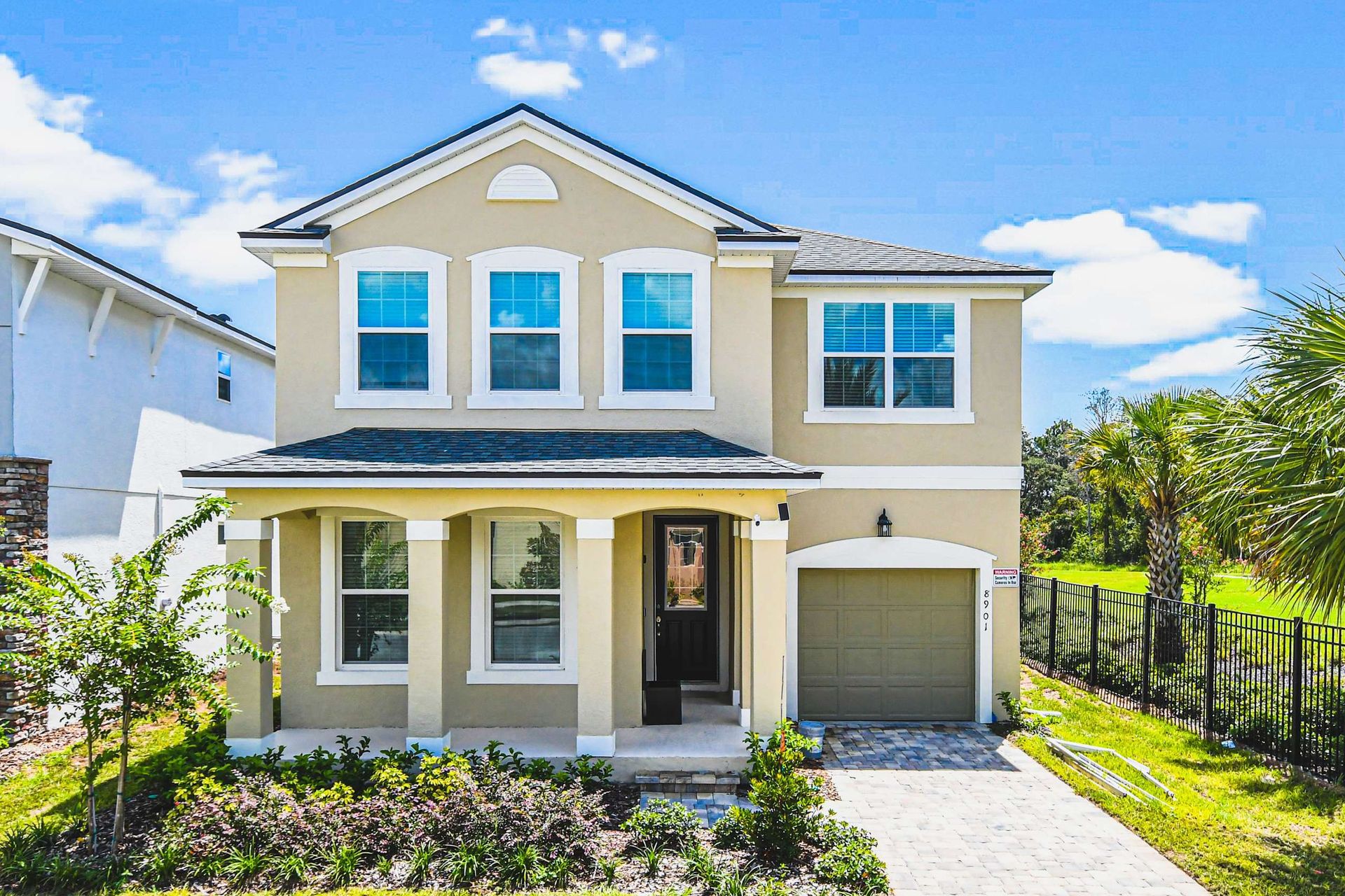 Bright and modern villa with lush views, private garage, and sunny outdoor space.