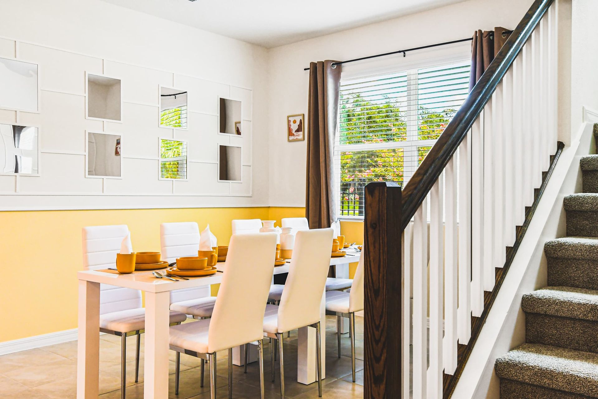 Cozy dining space with natural light, modern decor, and seating for eight guests.