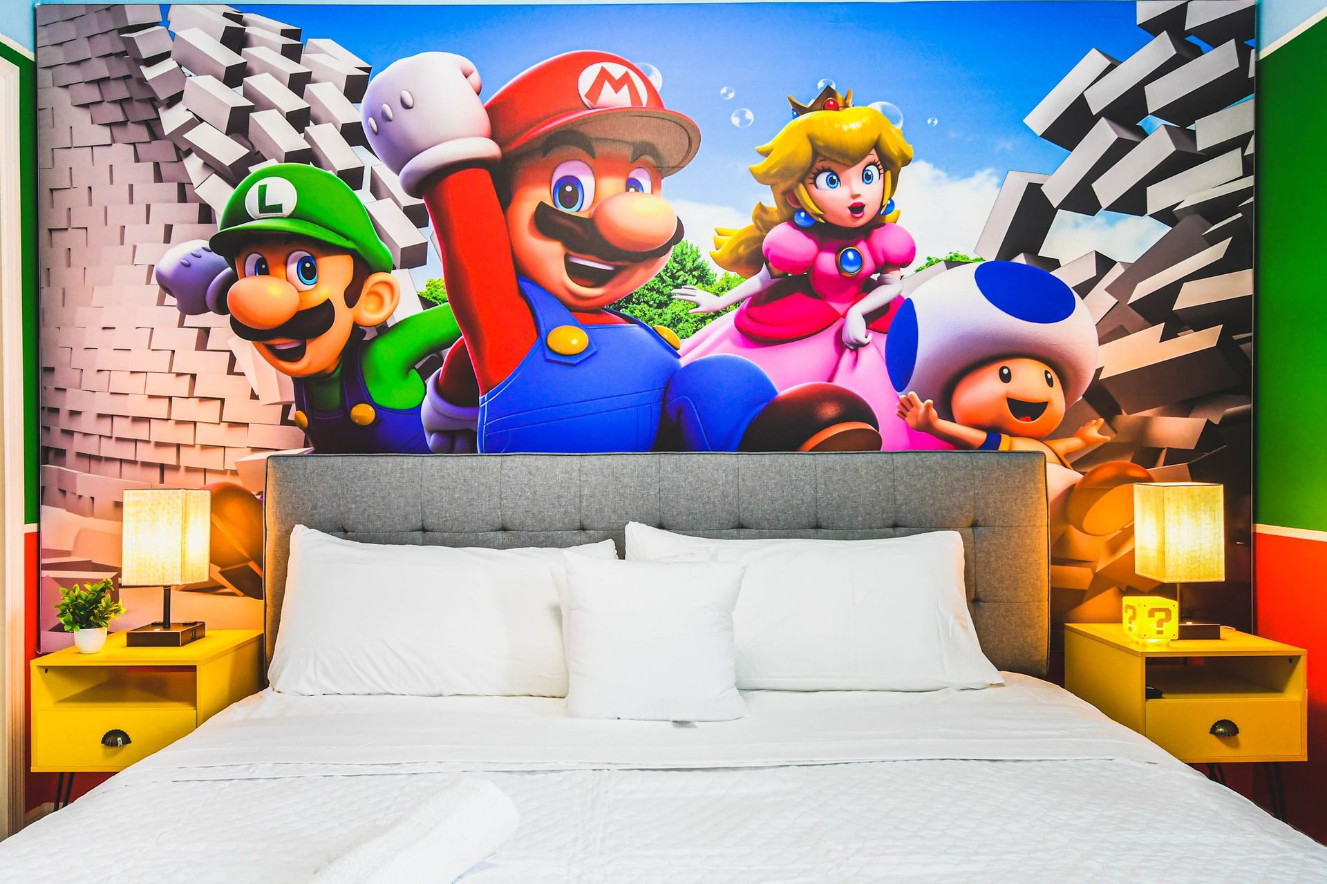 Mario-themed bedroom with vibrant colors, fun wall art, and cozy king bed vibes.