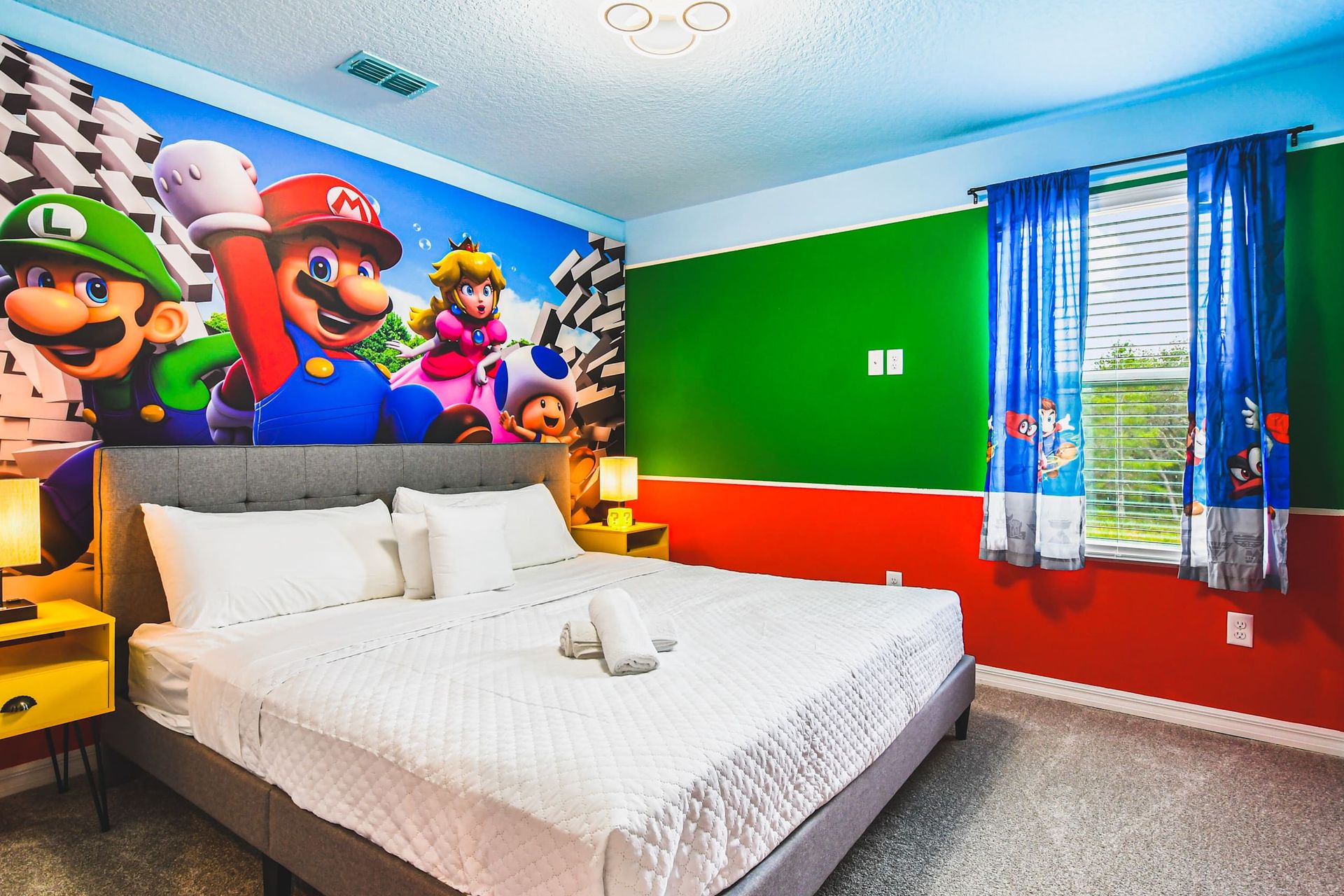 Mario-themed bedroom with vibrant colors, fun wall art, and cozy king bed vibes.