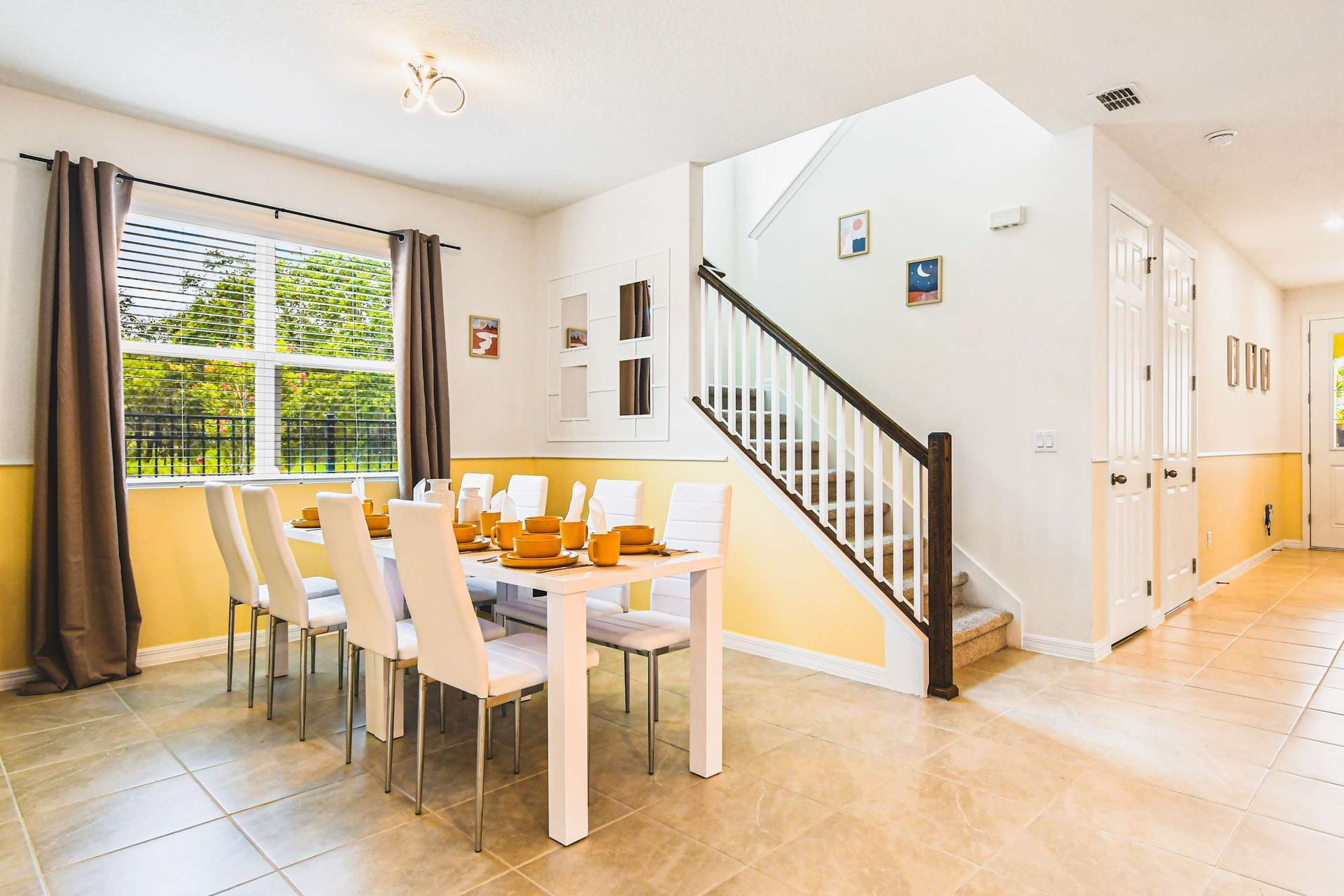 Bright dining area with garden views, stylish accents, and space for family meals.