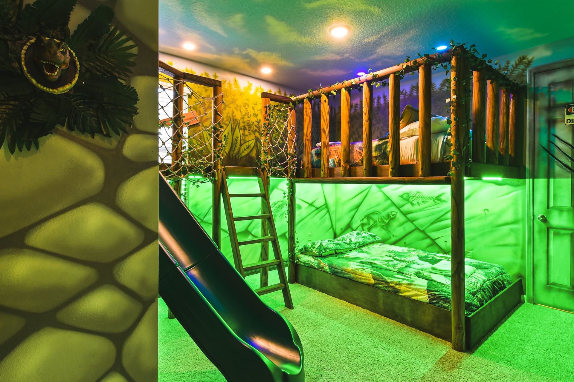 This fun Jurassic themed bedroom includes one full over full bunk bed and even a slide! This bedroom will definitely be a favourite.