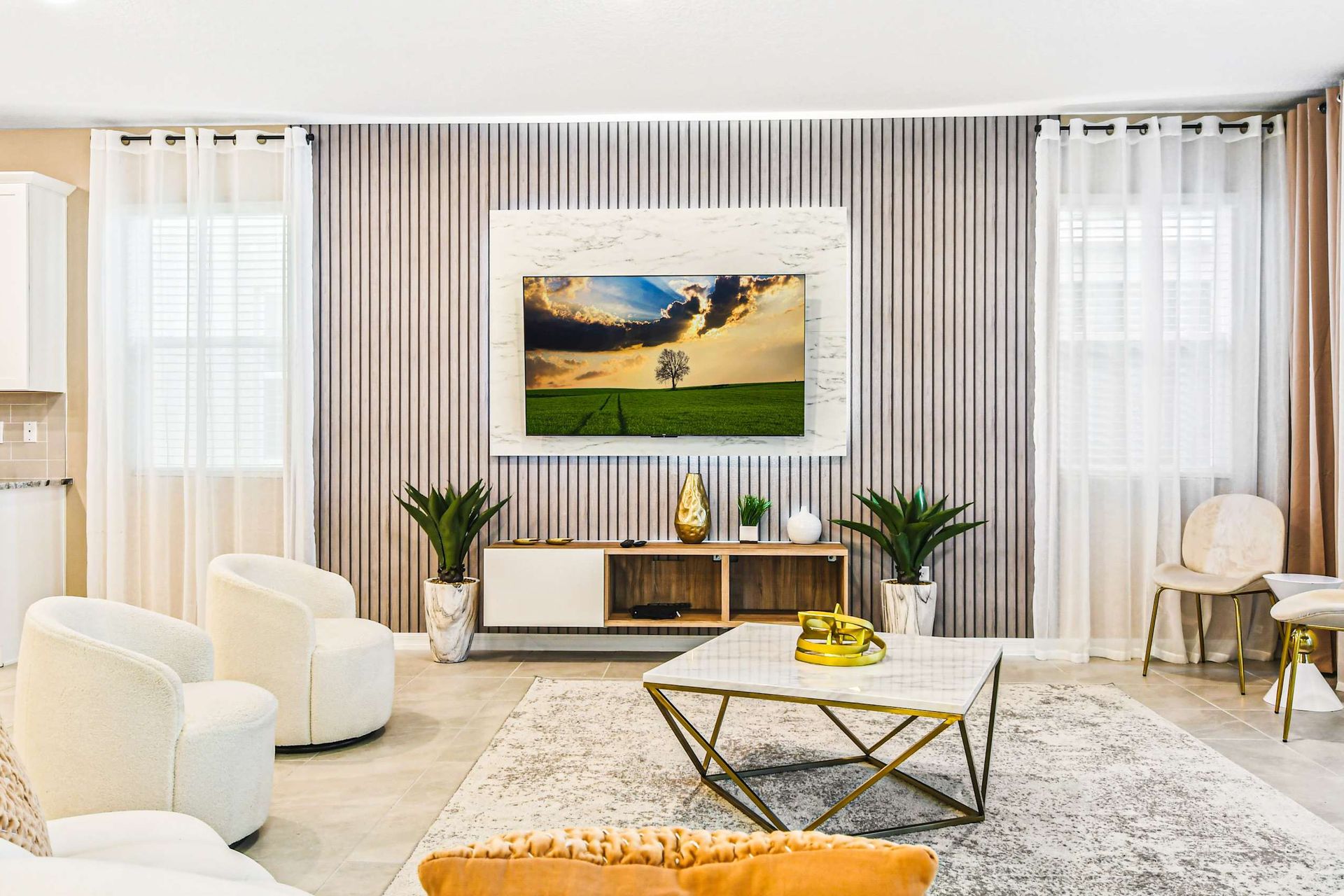 Modern, elegant living room with cozy seating and natural light.