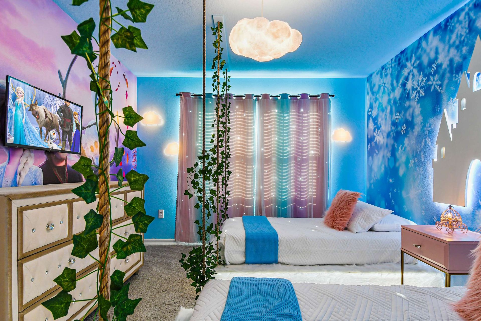 Magical twin room with snowflake castle mural, soft lights, and enchanting decor.
