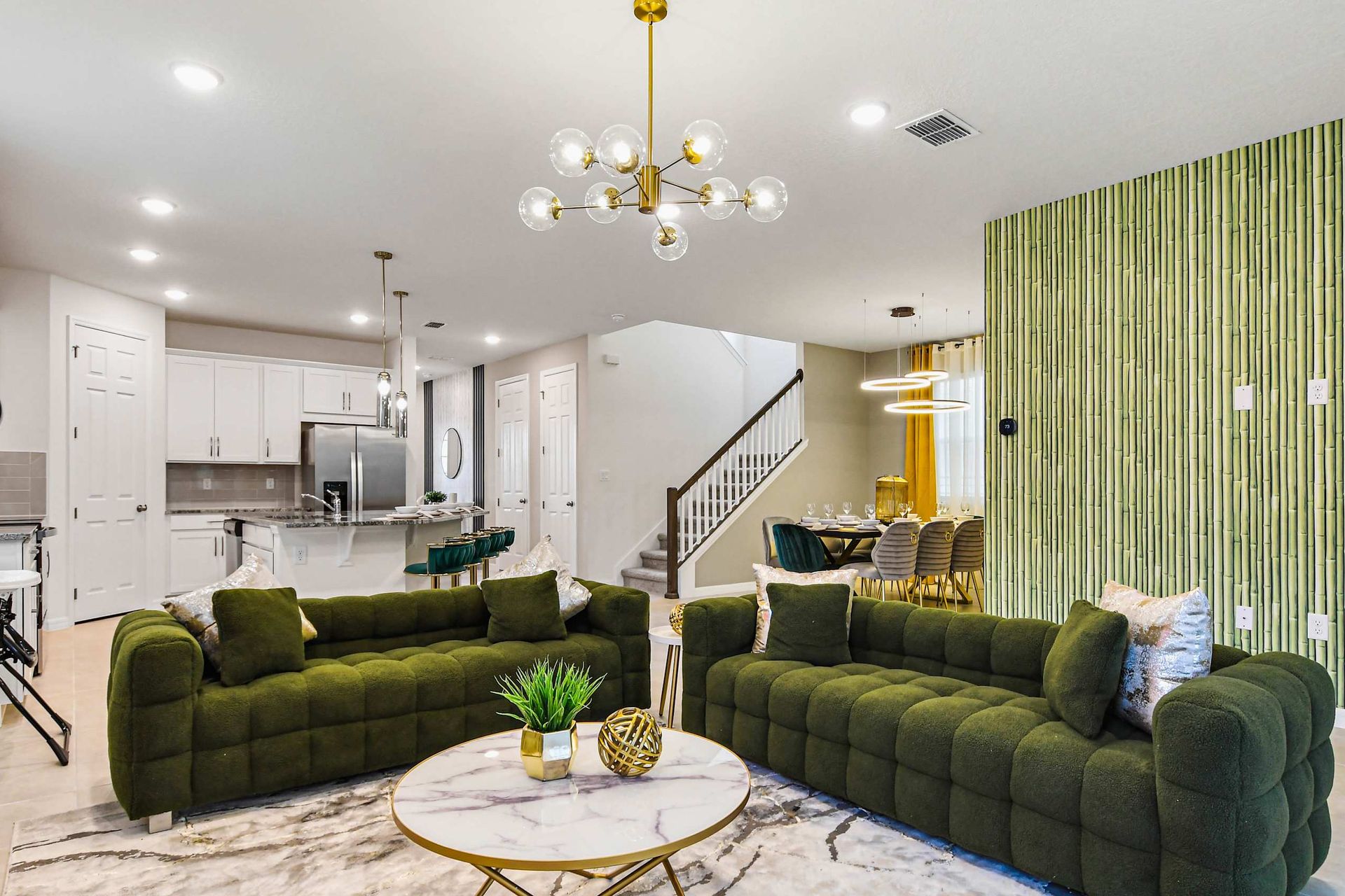 Stylish open-concept home with bold green accents and elegant modern touches.