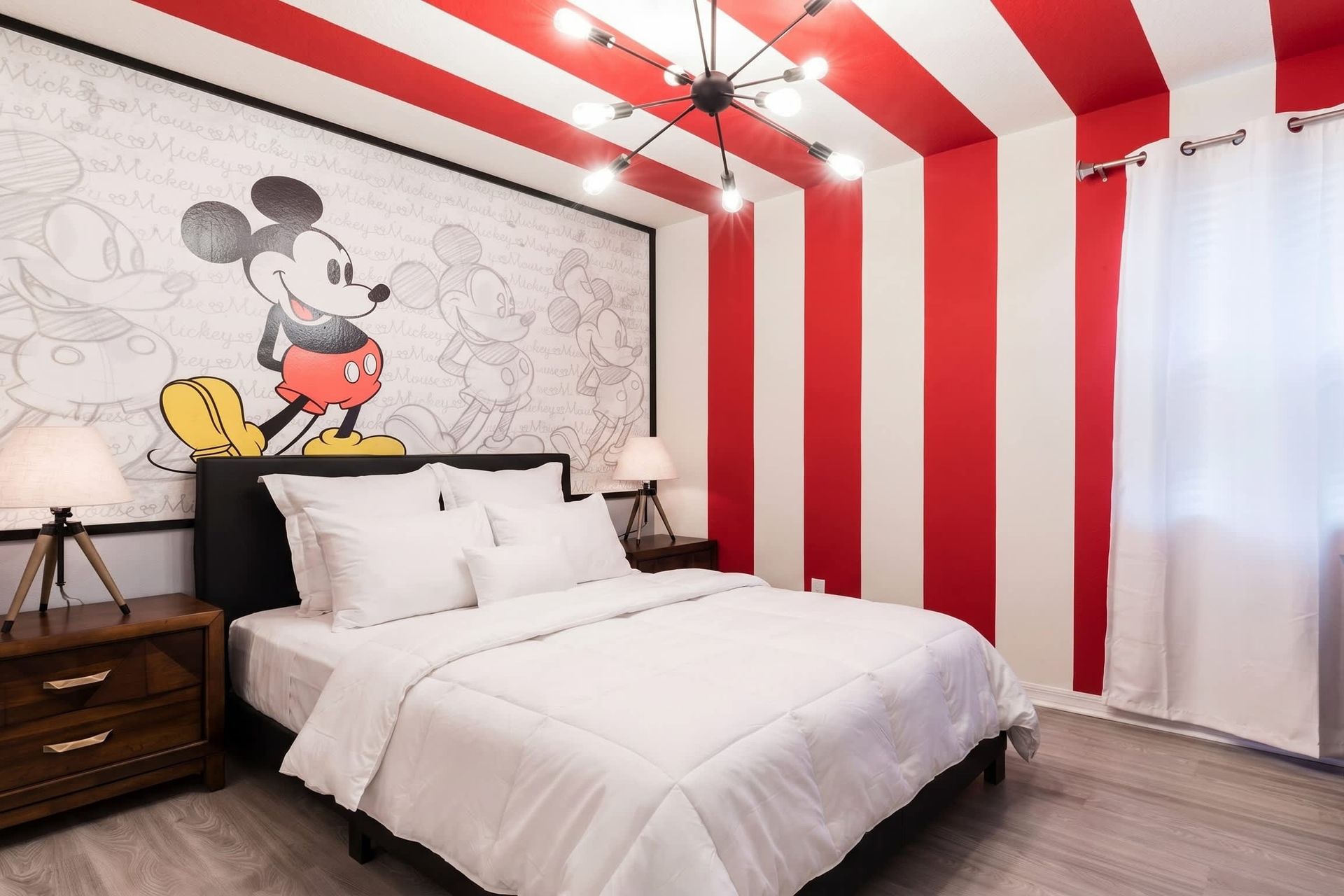 Cheerful Mickey Mouse-themed bedroom with bold stripes and fun decor!