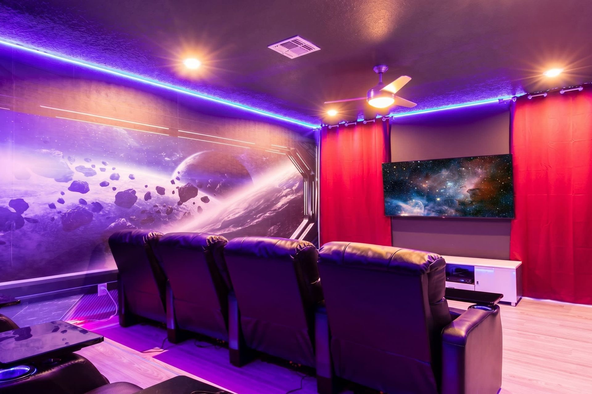 Immersive space-themed home theater with recliners and LED lighting!