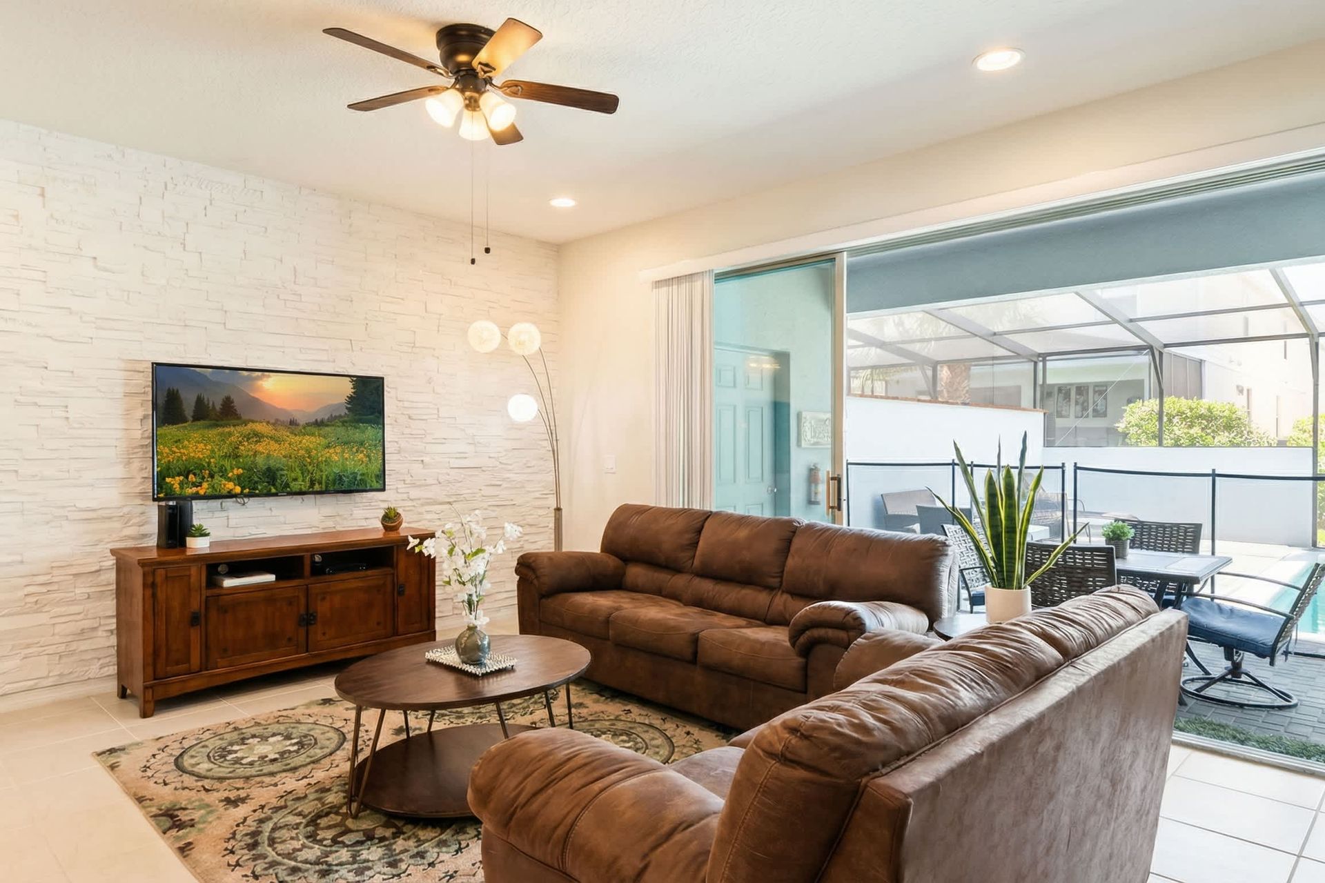 Cozy living space with poolside access, perfect for relaxing and entertaining guests.