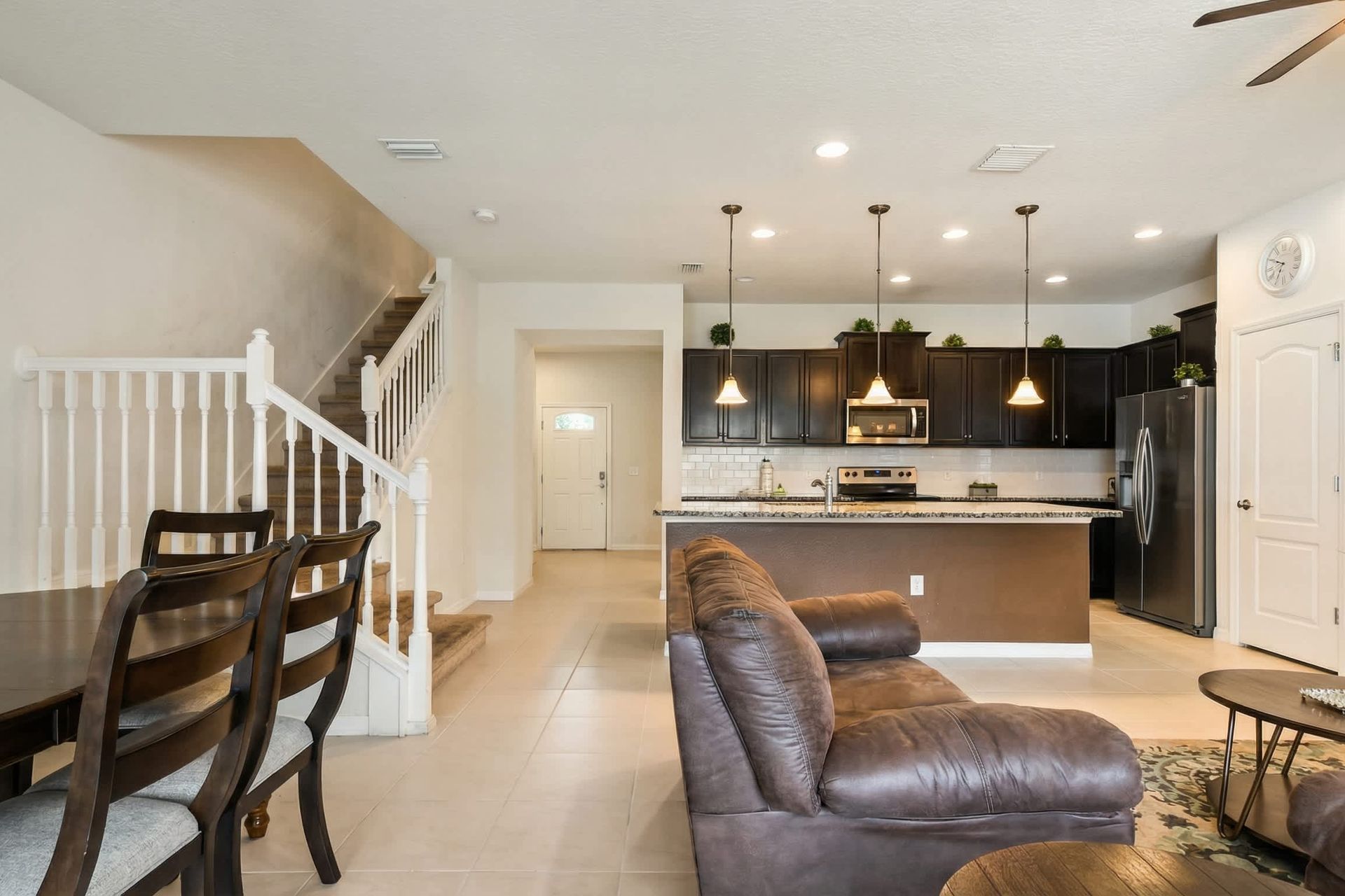 Elegant open kitchen and dining area with warm lighting and inviting modern style.
