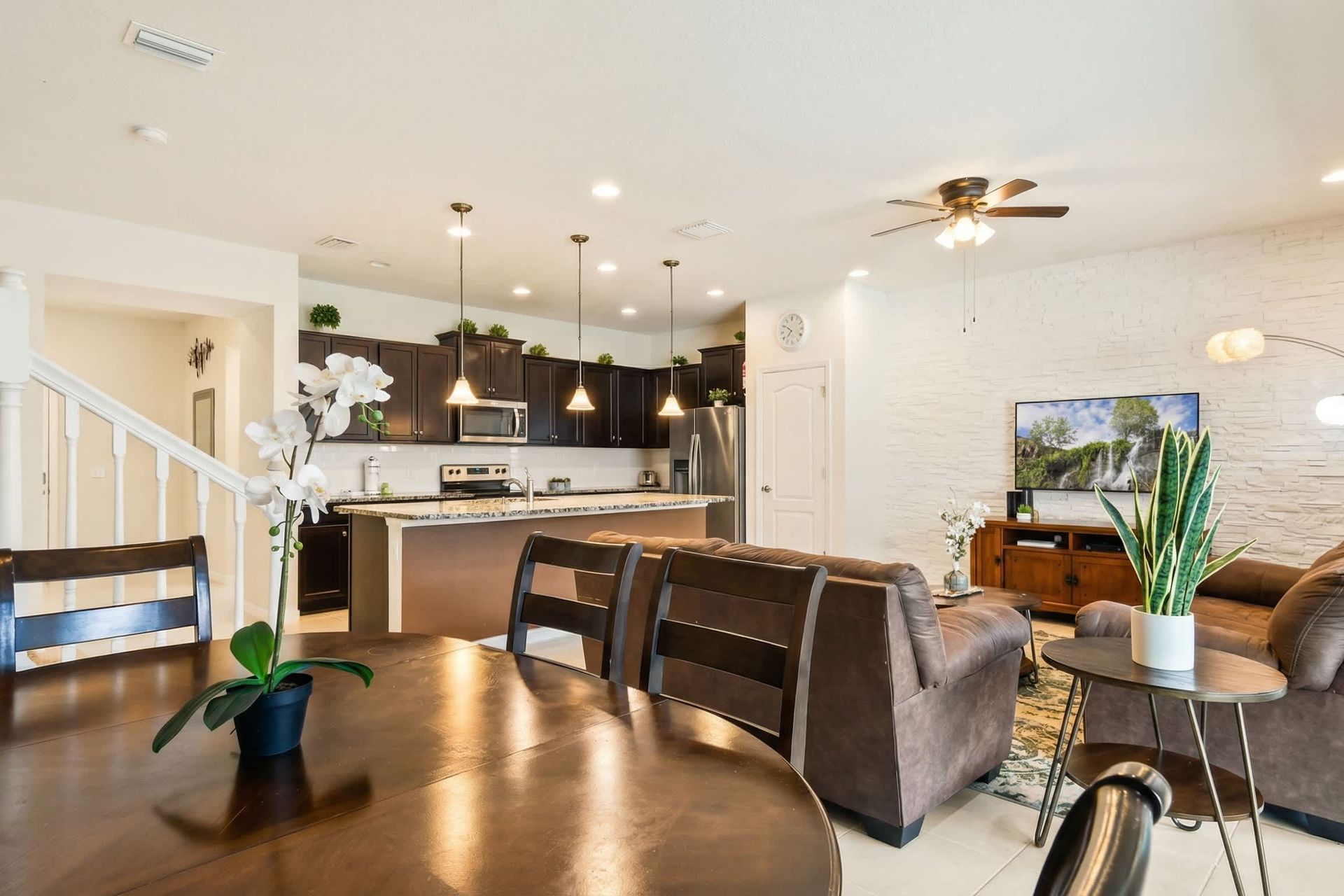 Stylish open-concept living, dining, and kitchen area designed for comfort and gatherings.