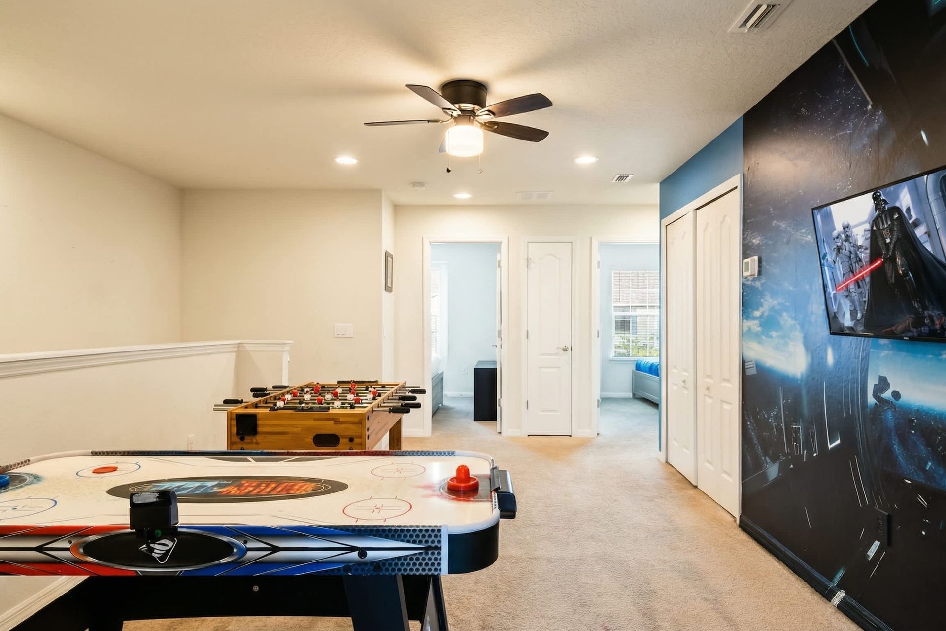 Enjoy endless fun in this Star Wars-themed game room with air hockey and foosball!