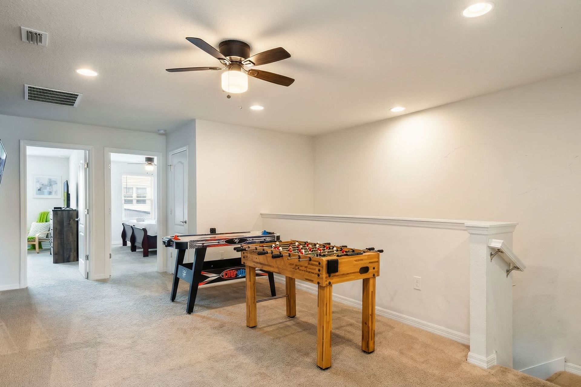 Upstairs game loft with foosball and air hockey, perfect for family fun time.