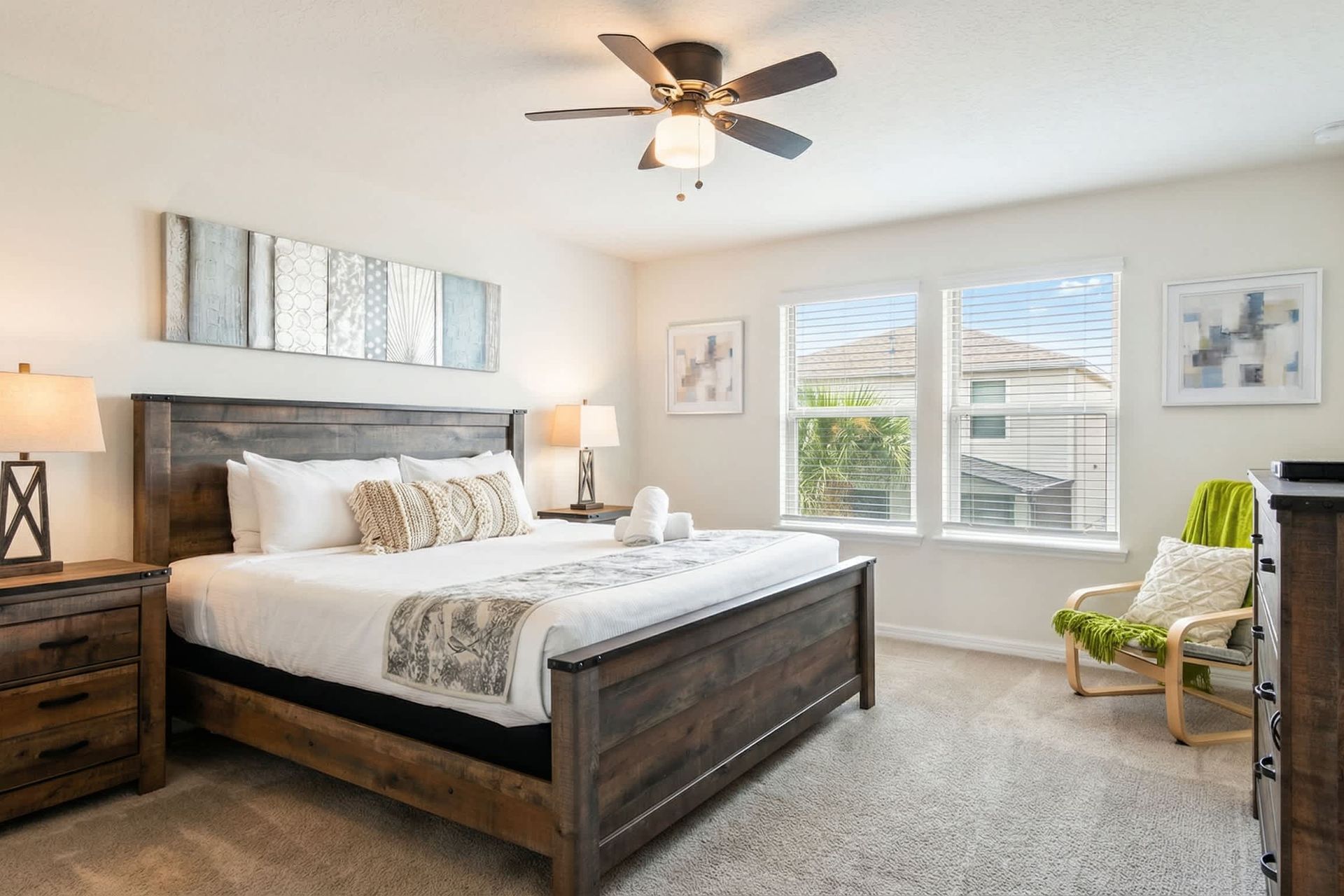 Unwind in this serene king bedroom with rustic charm and bright natural light.