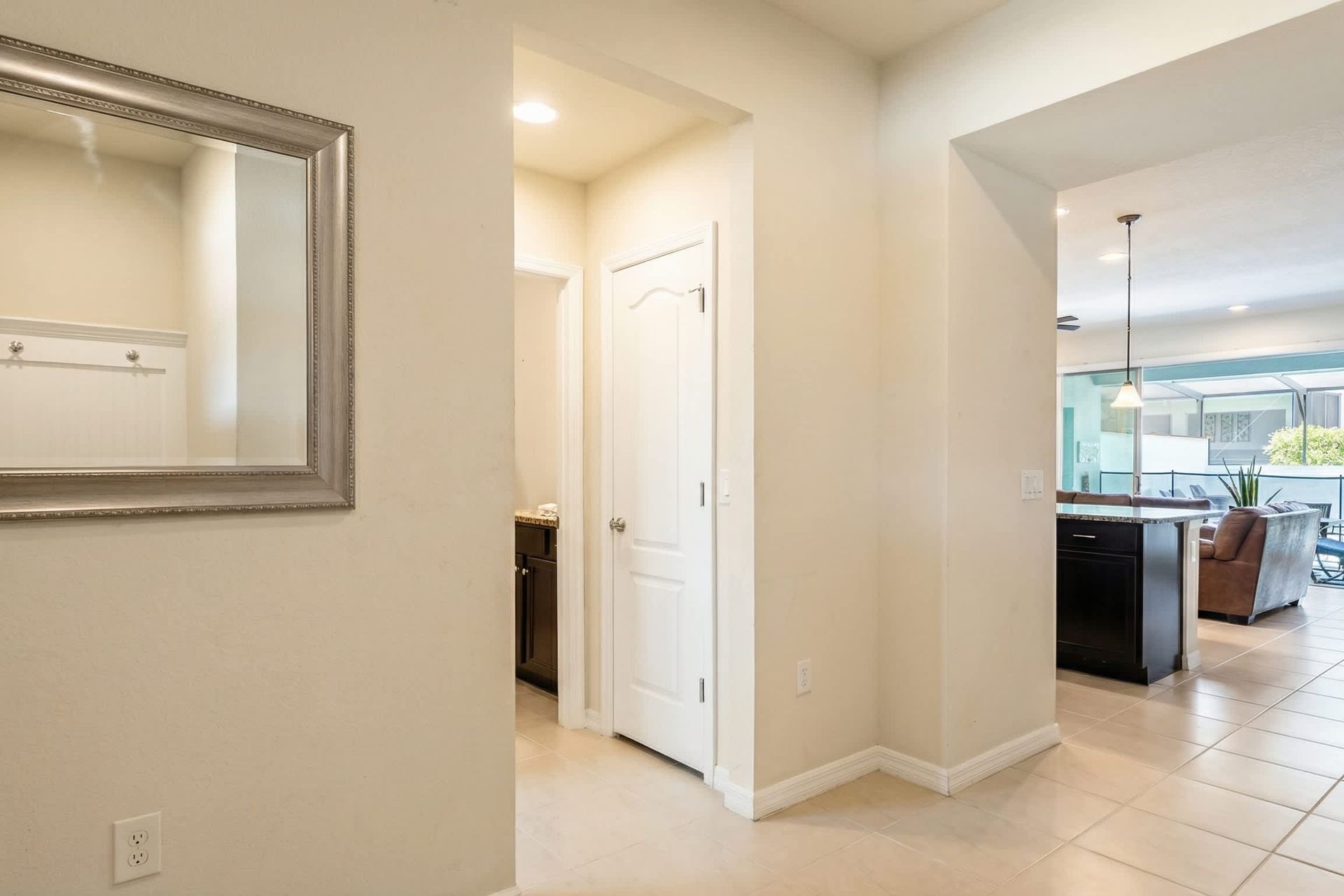 Bright, open entryway leading to spacious living and poolside relaxation.