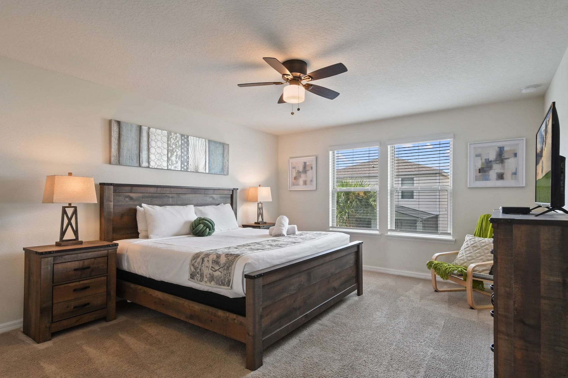 Unwind in this serene king bedroom with rustic charm and bright natural light.