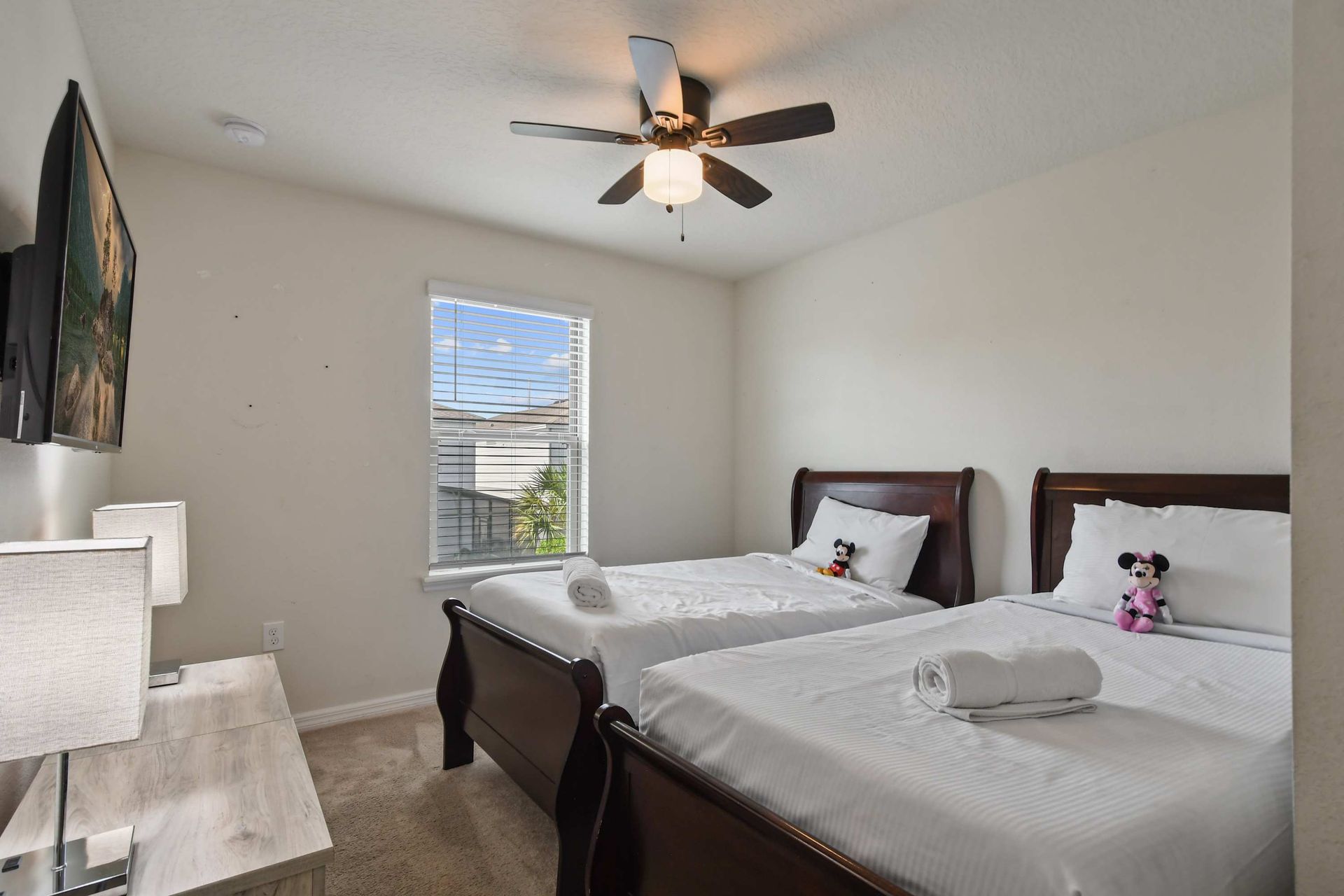 Charming twin bedroom with Disney touches, perfect for kids or family travelers.