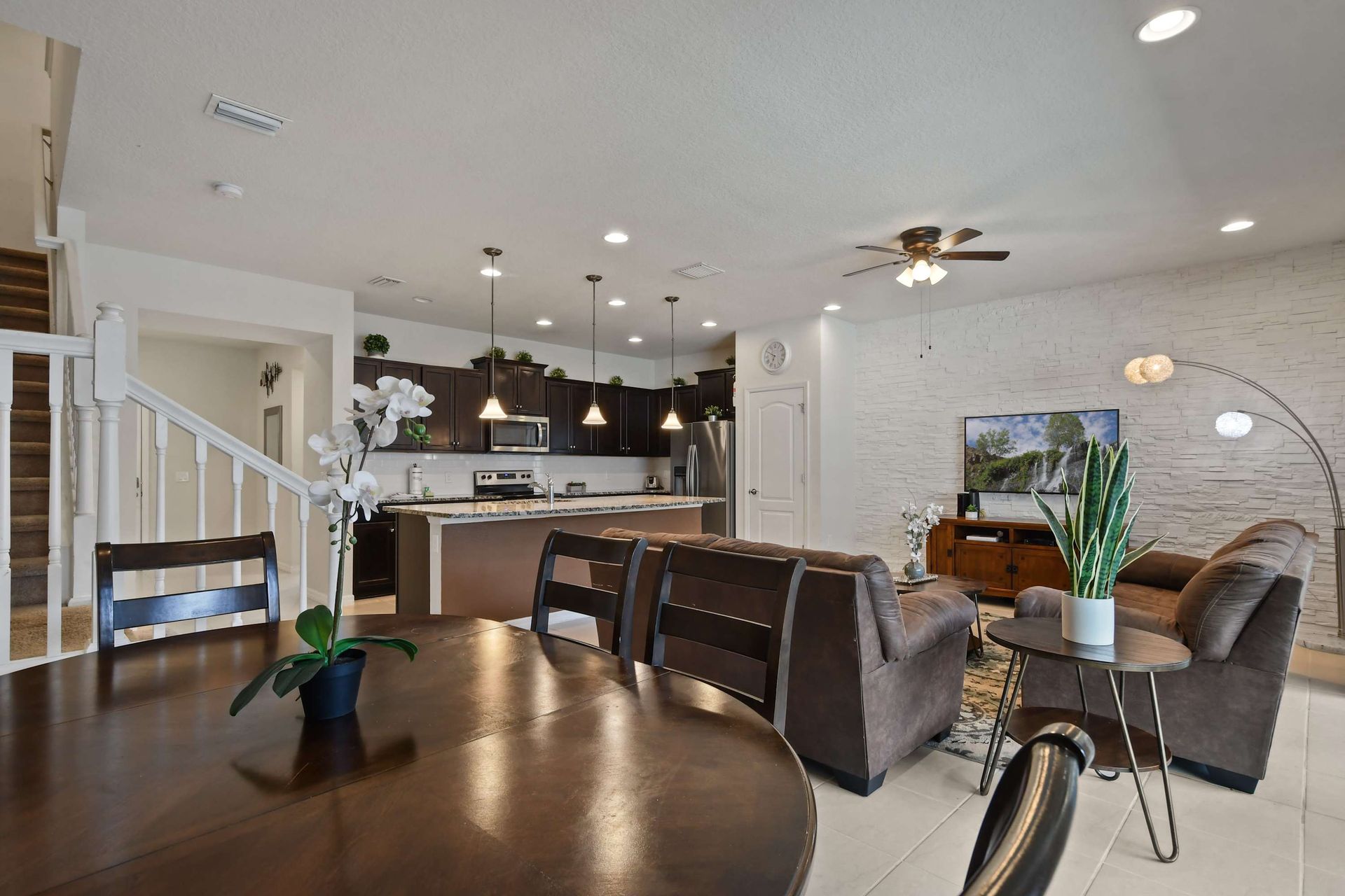 Stylish open-concept living, dining, and kitchen area designed for comfort and gatherings.