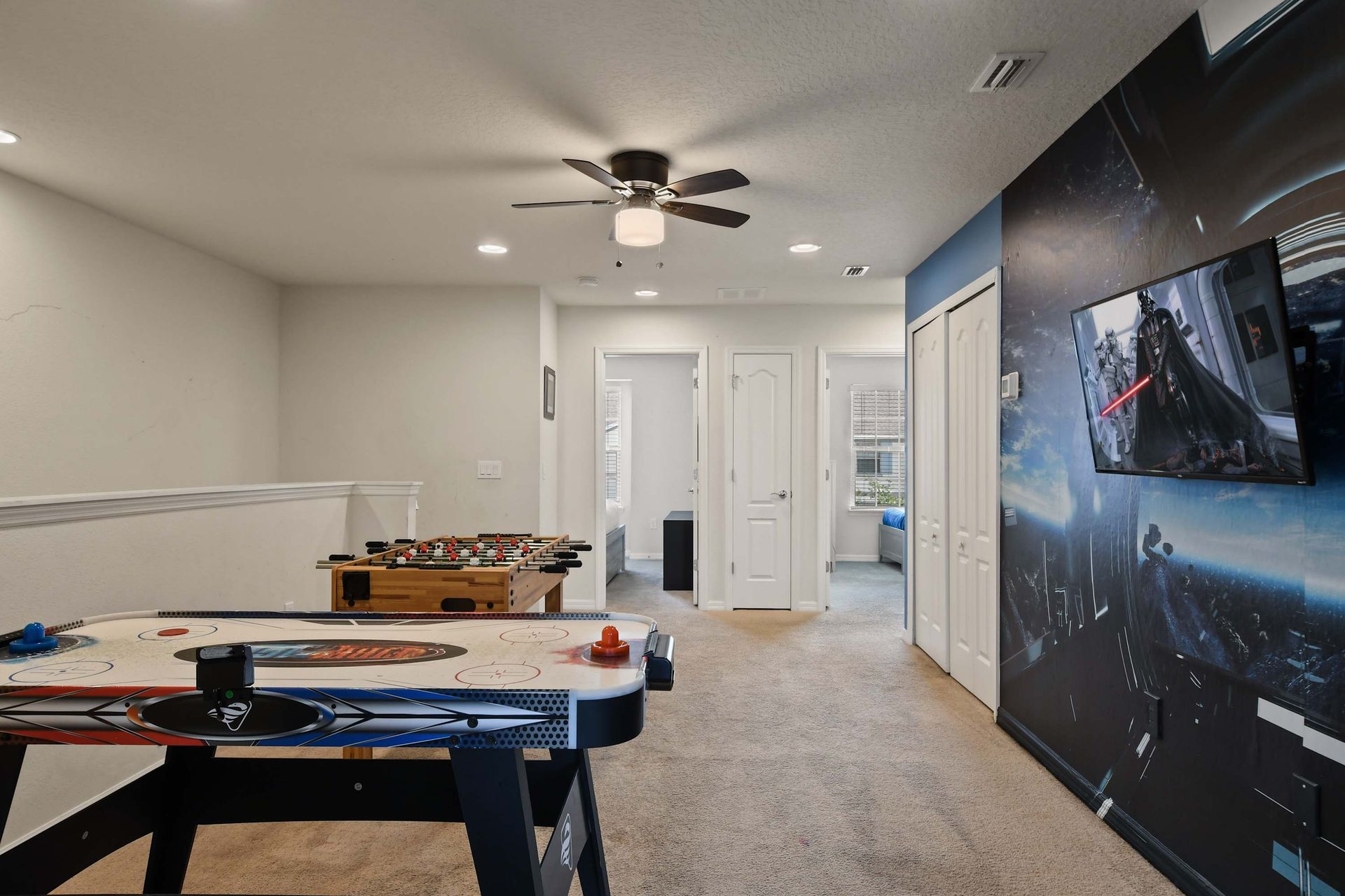 Enjoy endless fun in this Star Wars-themed game room with air hockey and foosball!