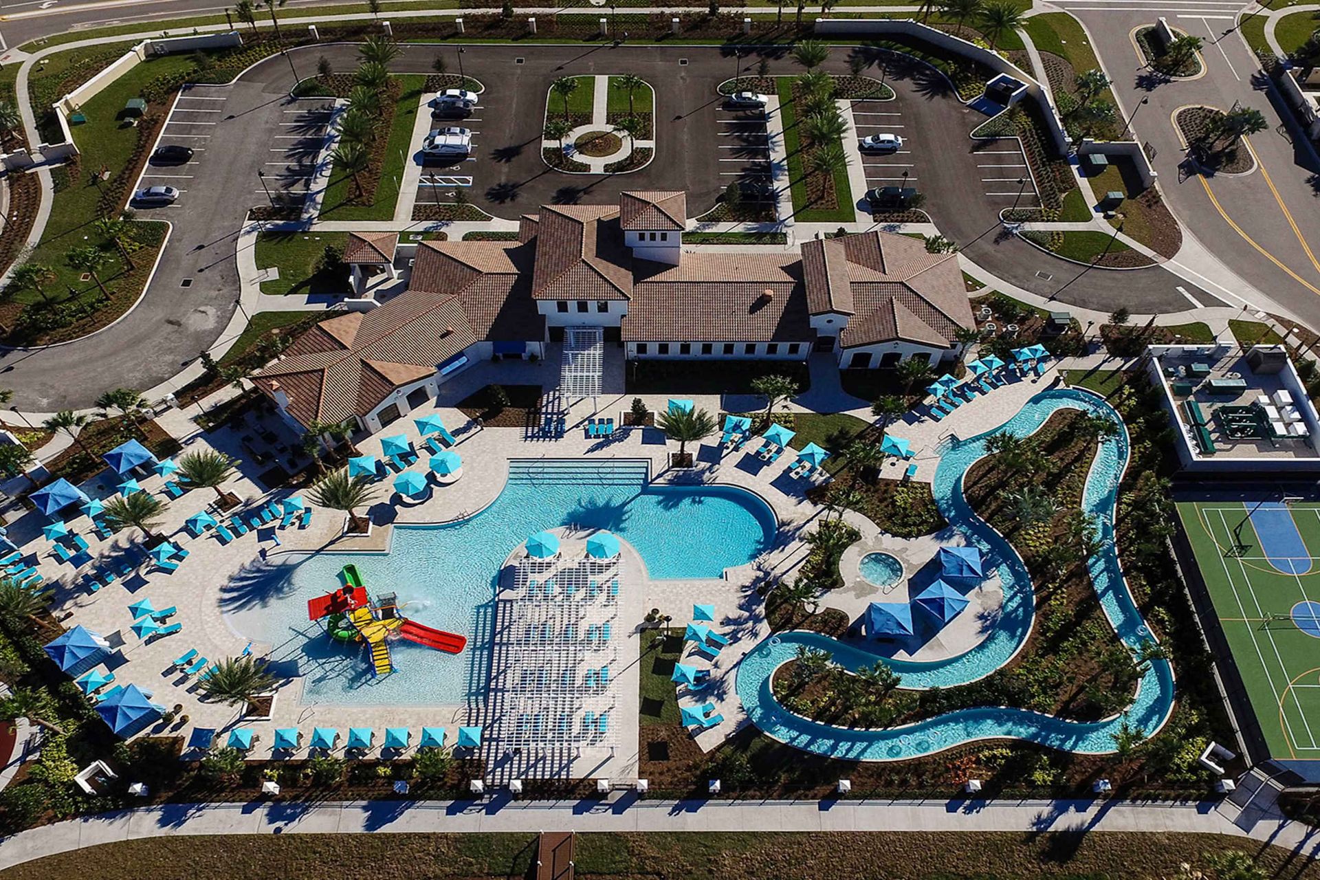 Aerial view of luxury resort amenities: pools, lazy river, splash park, and sports courts!
