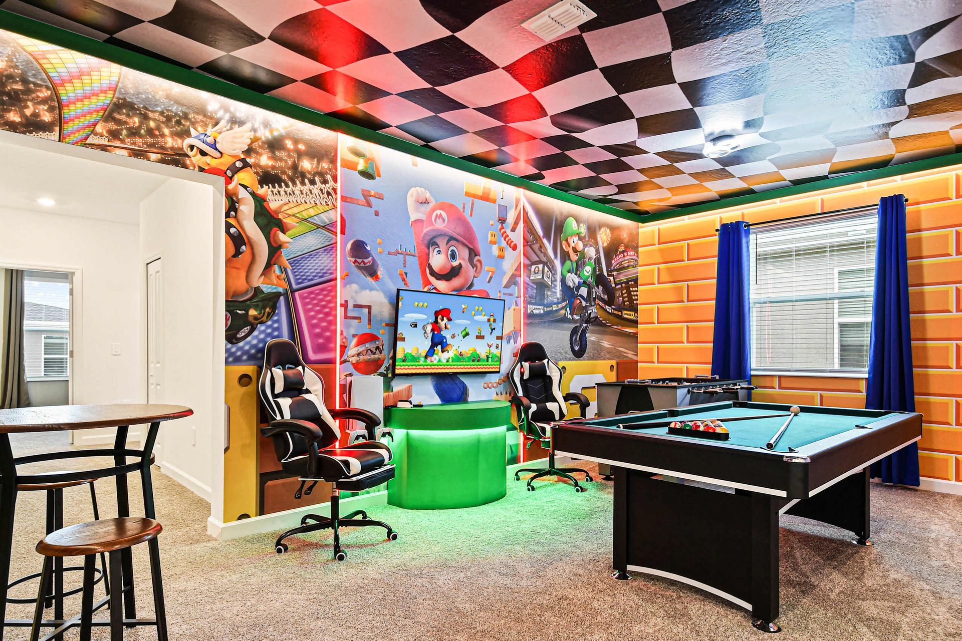 Vibrant game room with arcade décor, gaming chairs, pool table, and endless fun.