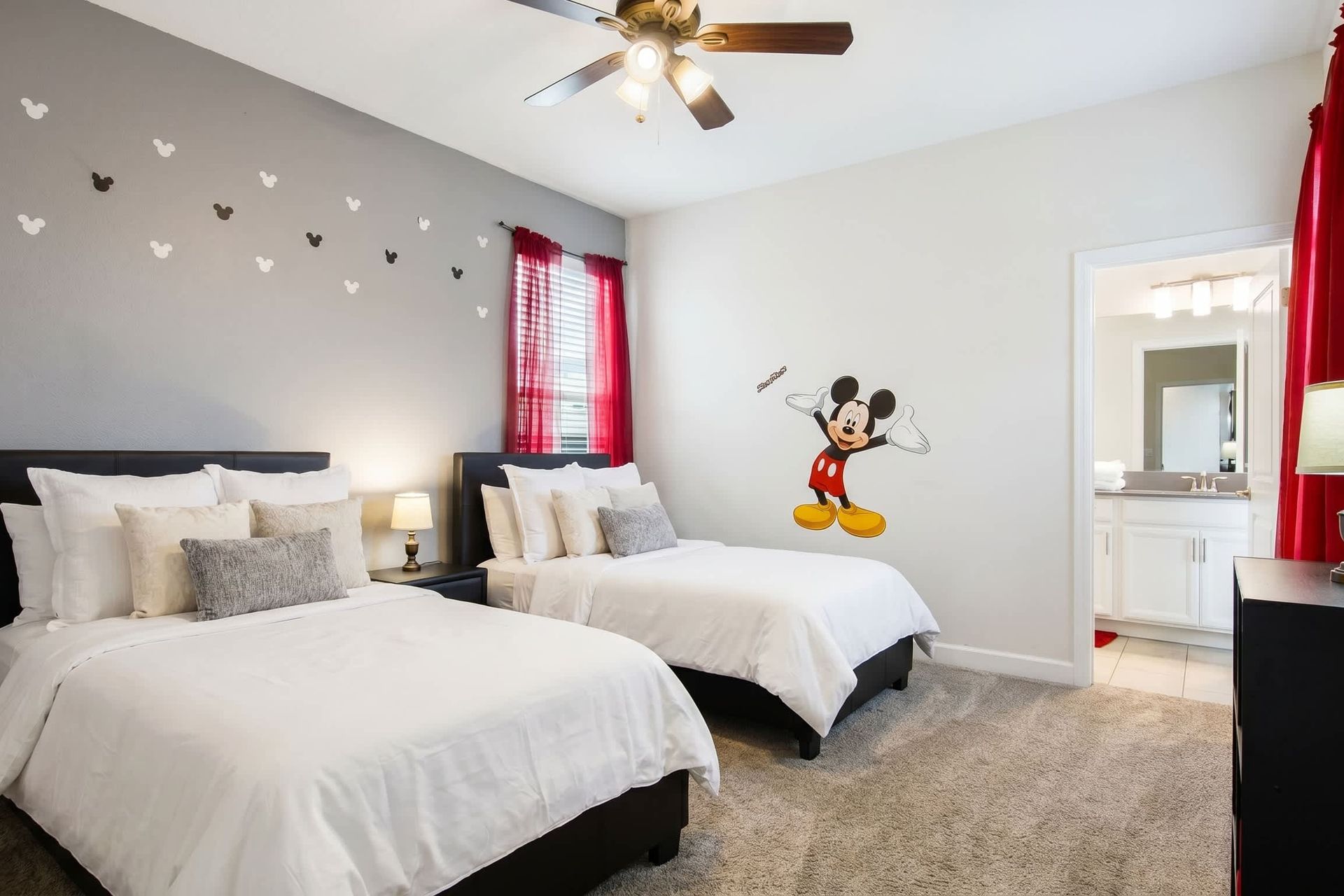 Experience a comfortable stay in our Mickey Mouse inspired room with two beds, offering you the perfect space to relax and recharge after a day of adventure.