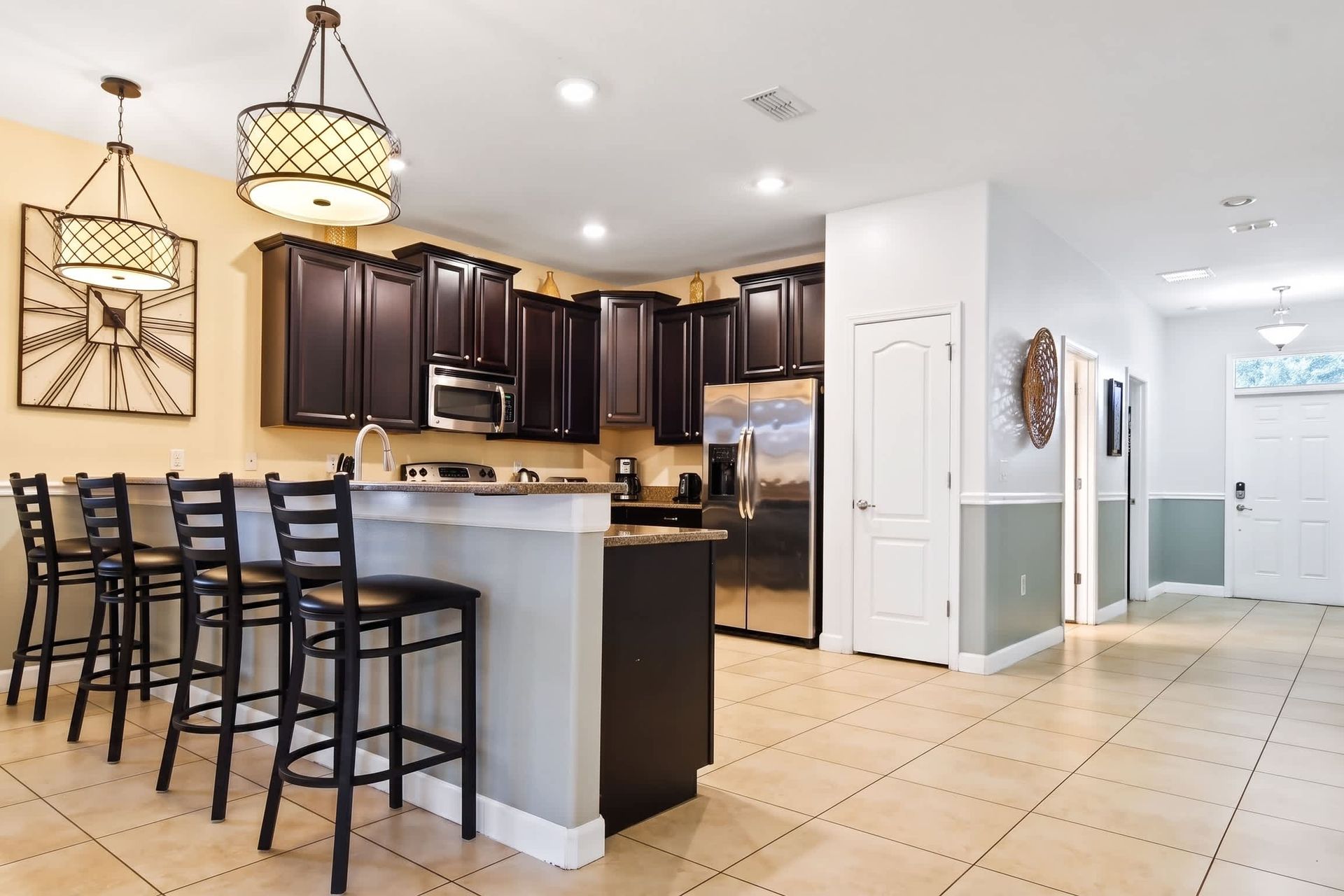 Modern kitchen seamlessly integrated with a sleek mini bar