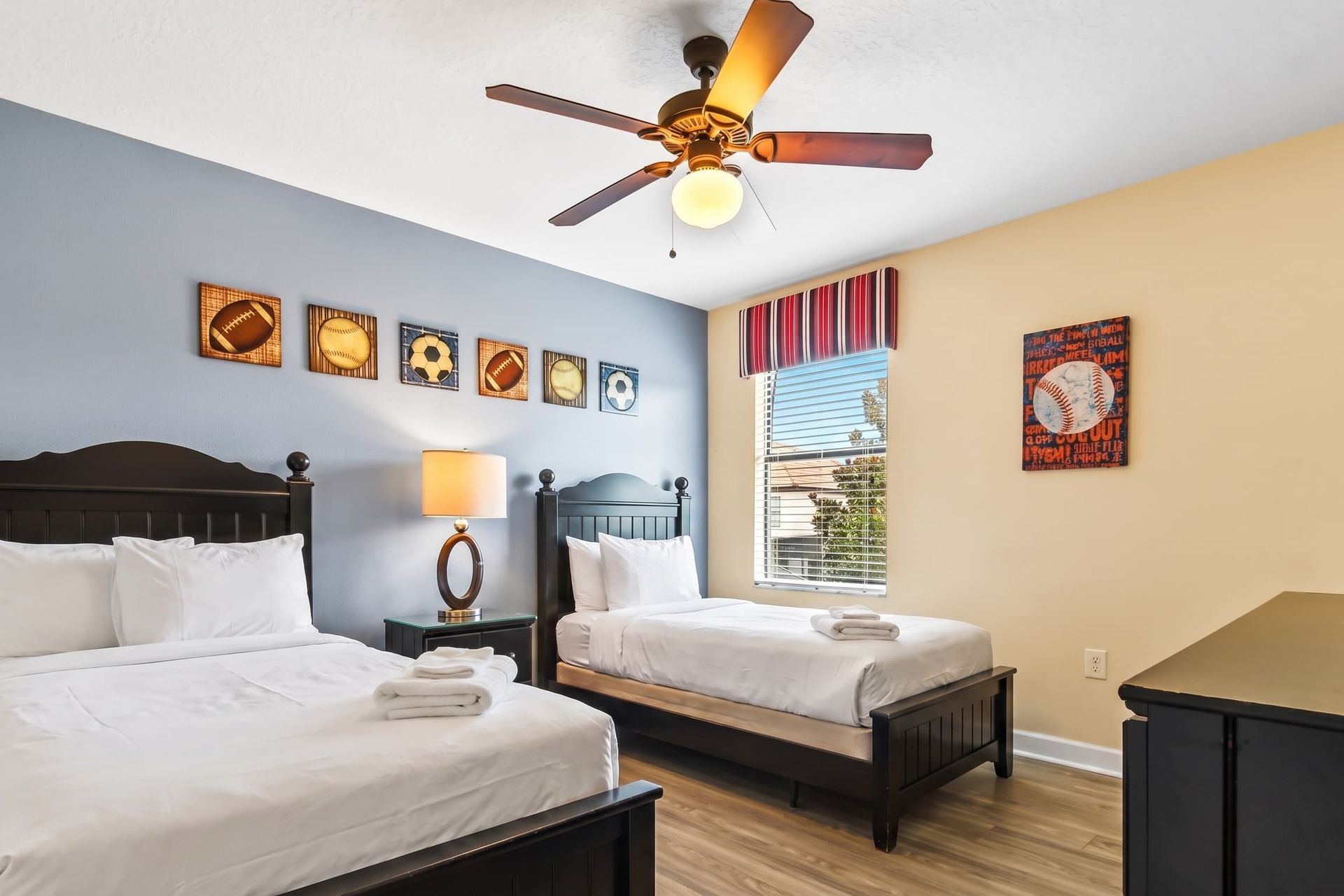 Well-appointed bedroom featuring double bed and one single bed